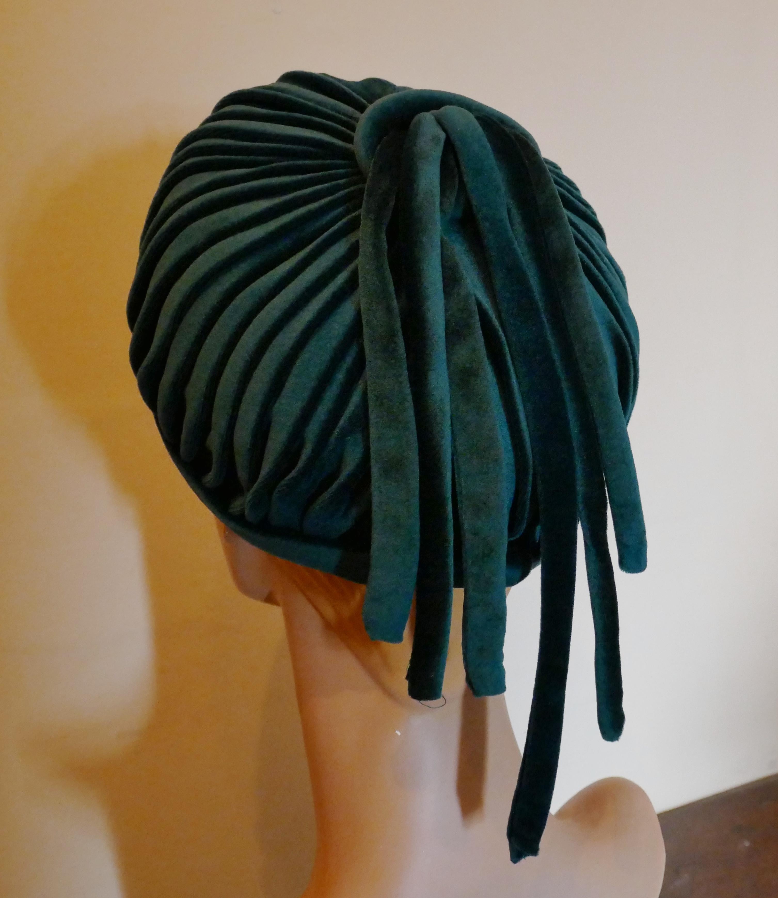 Original 1960s Formal Beret Style Peacock Blue Velvet Pill Box Hat, 

Stunning pleated beret pill box hat, the pleated velvet is gathered on the top, hanging as  ringlets from the centre 
This is a formal hat with a stylish shape and lined in satin,