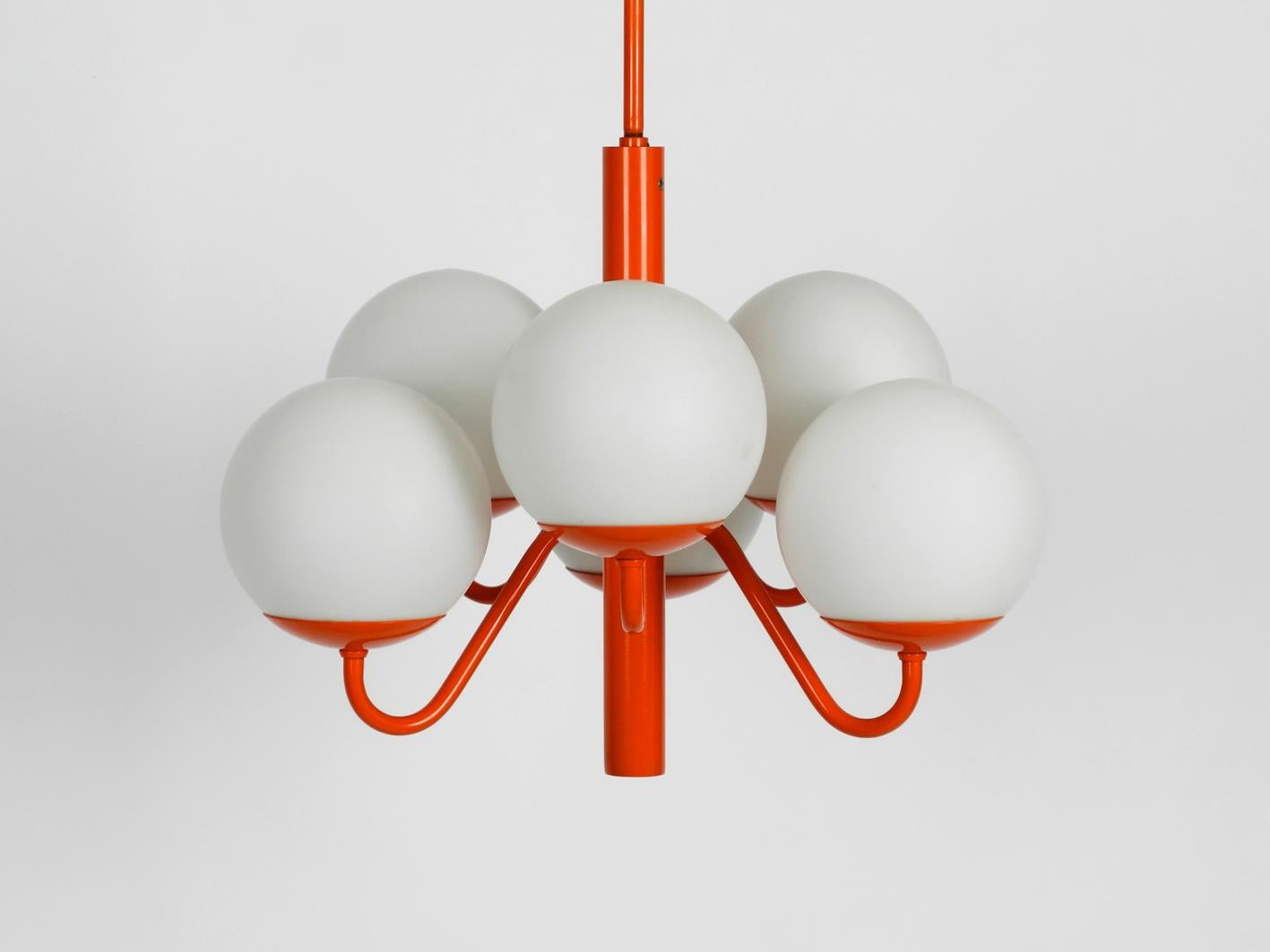 Rare Kaiser Leuchten metal ceiling lamp with six opal glasses.
Beautiful 1960s Space Age Pop Art design in orange.
Very good vintage condition with no damages. Original coating very well preserved. 100% original condition and fully