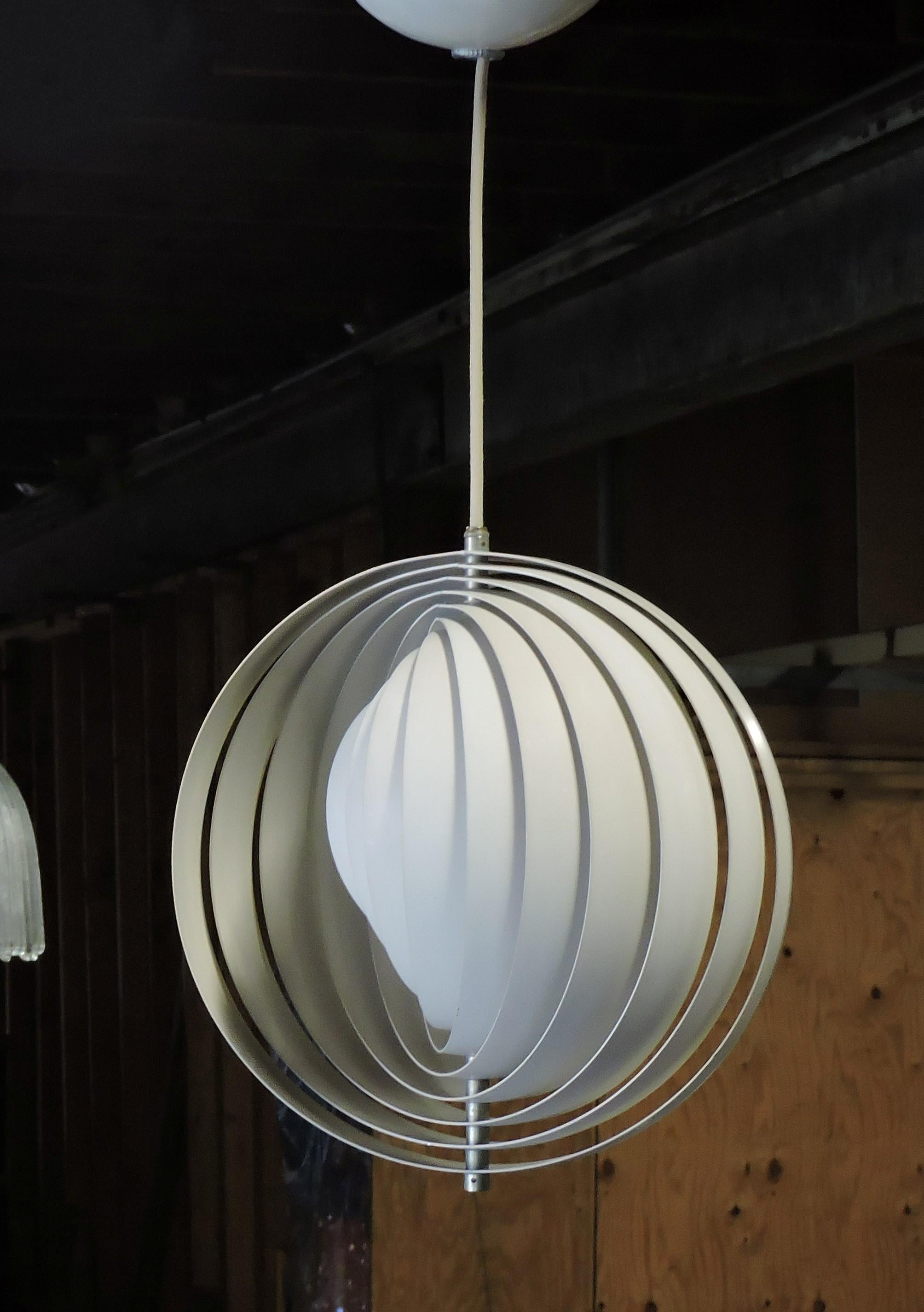 Original moon pendant lamp designed by Verner Panton and made in Denmark by Louis Poulsen. A beautiful early design by Verner Panton, this lamp has ten adjustable rings which artfully diffuse the light. It has all new wiring and the original Louis