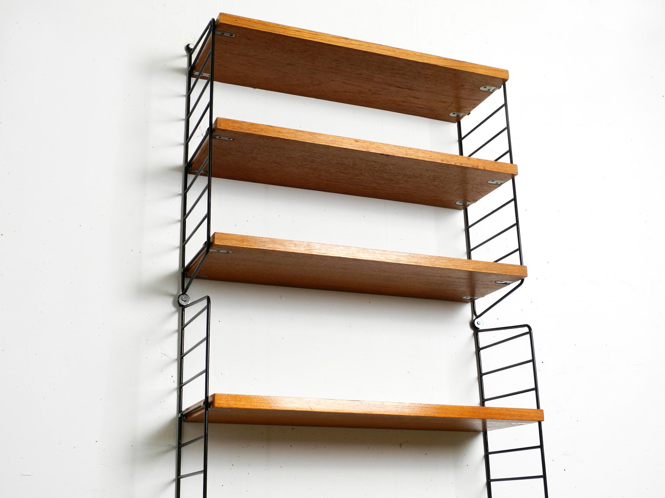 Original 1960's narrow teak Nisse Strinning wall hanging shelf with five shelves 10