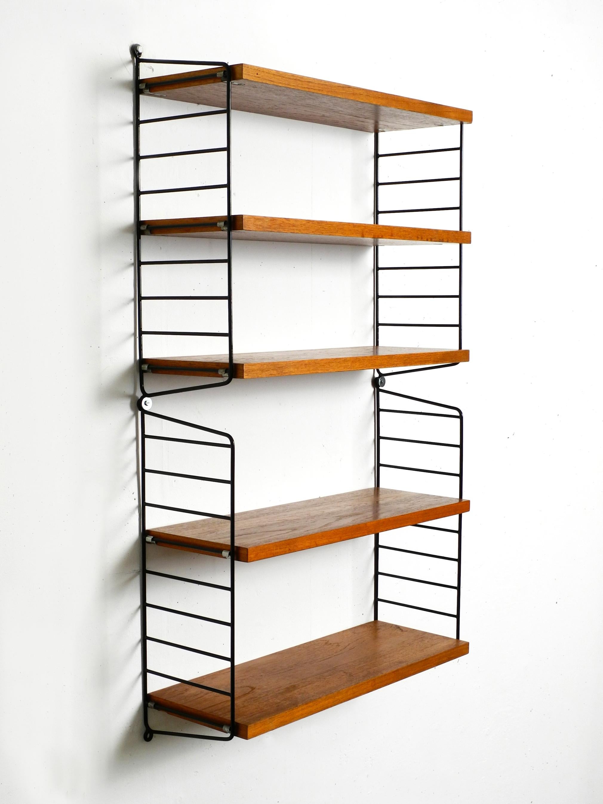 Original 1960's narrow teak Nisse Strinning wall hanging shelf with five shelves 11