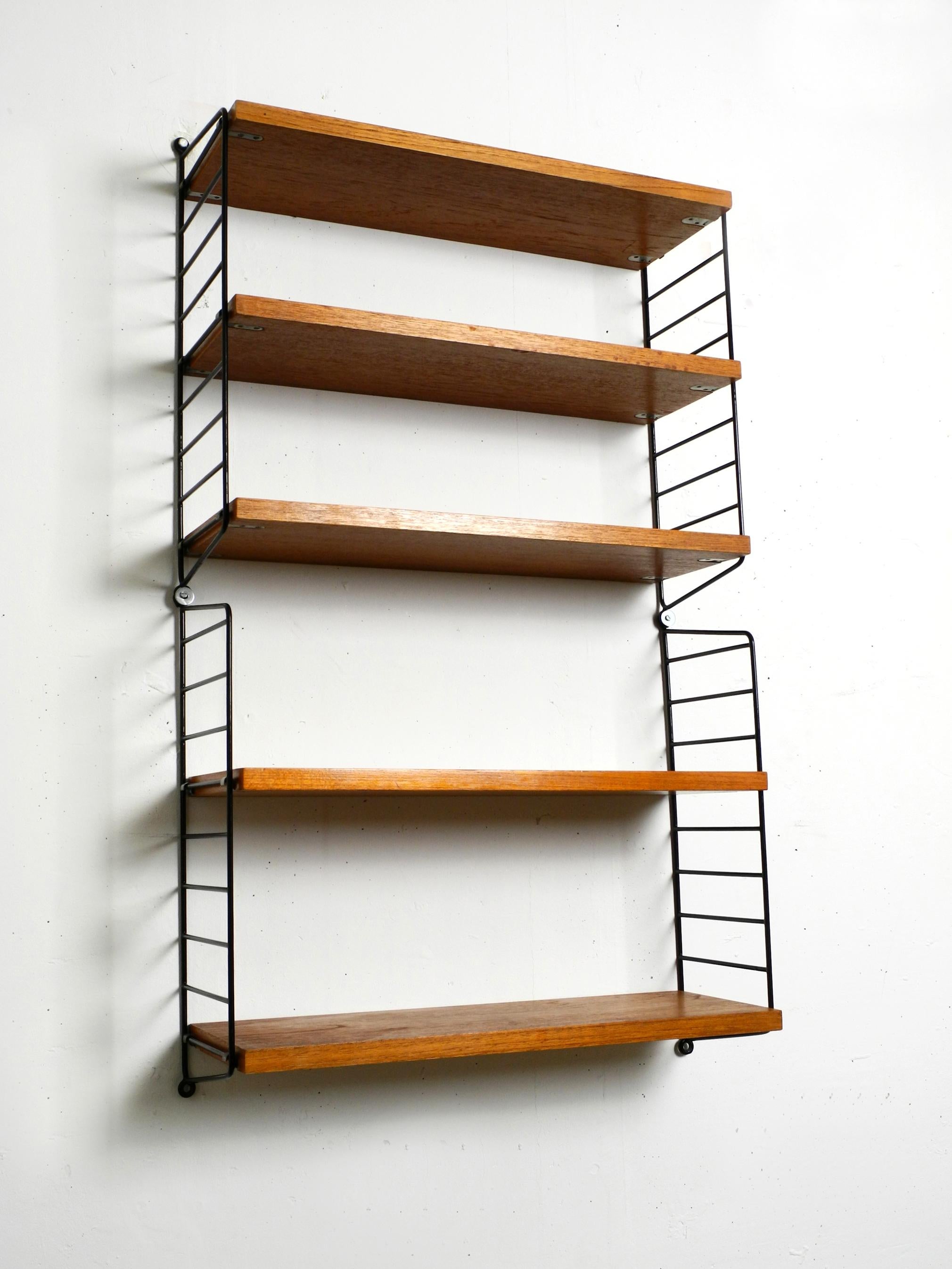 Original 1960's narrow teak Nisse Strinning wall hanging shelf with five shelves In Good Condition In München, DE