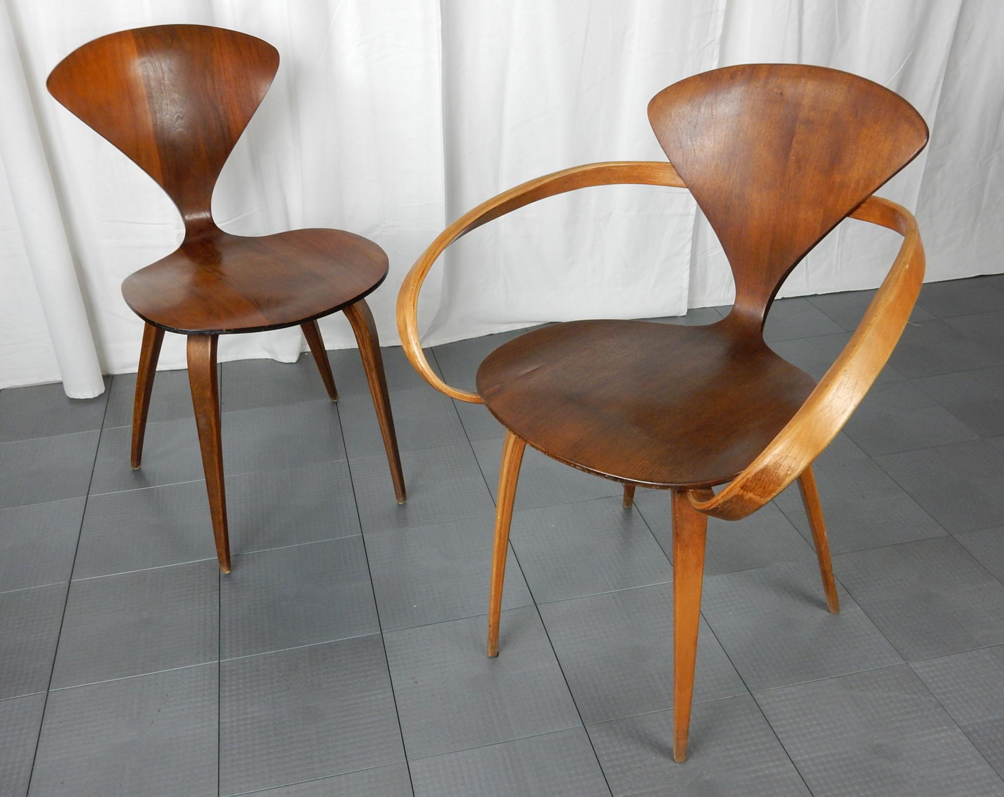 Fabulous pair of molded plywood accent chairs designed by Norman Cherner for Plycraft.
These are not reproductions rather original 1960s survivors.
Original Plycraft label on underside of side chair naming “Bernardo