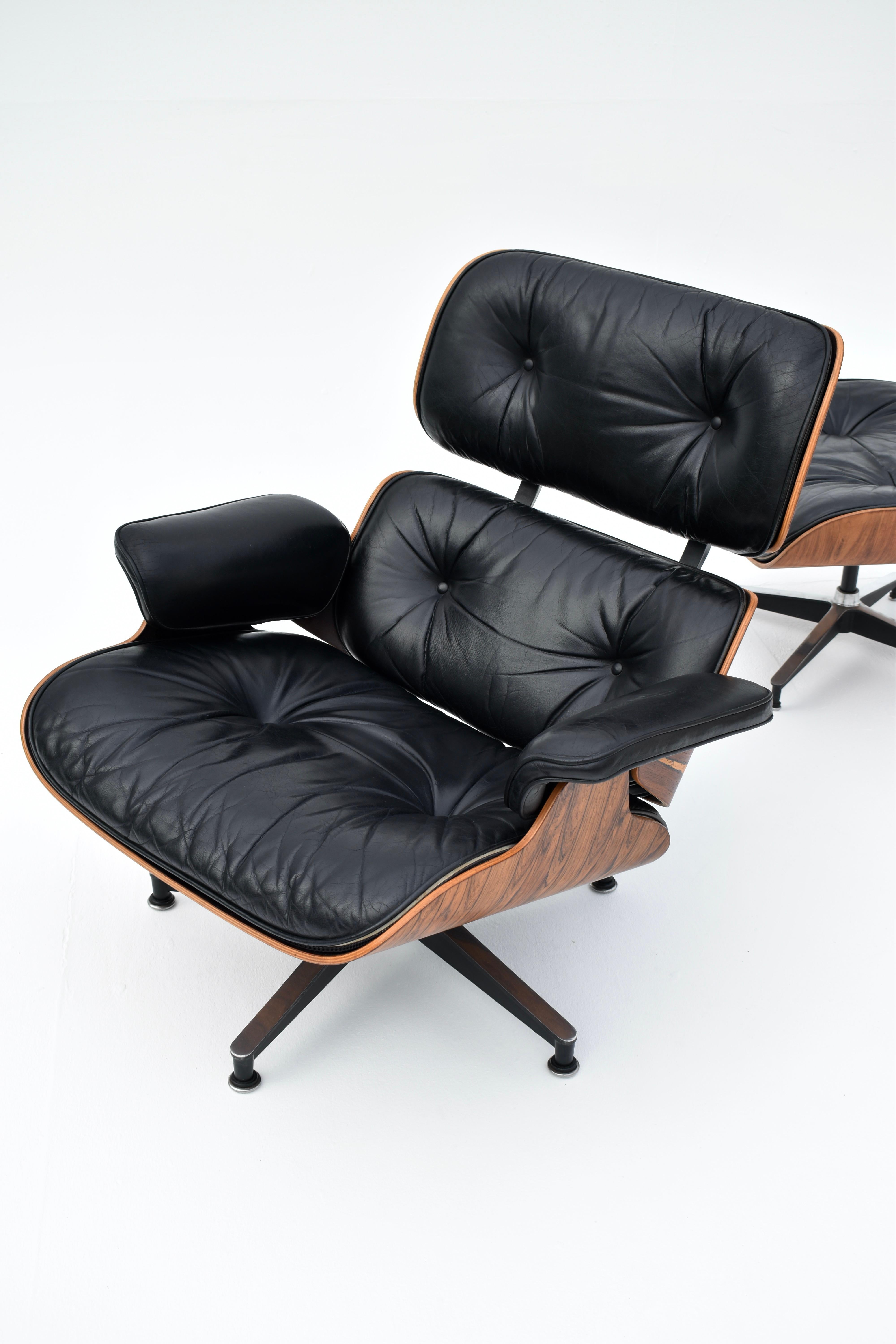 Original Eames Lounge Chair & Ottoman finished in Brazilian rosewood and black leather for Herman Miller.

A particularly nice example exhibiting very dramatic and attractive figuring to the rosewood veneers and gorgeous patina to the cushions. The