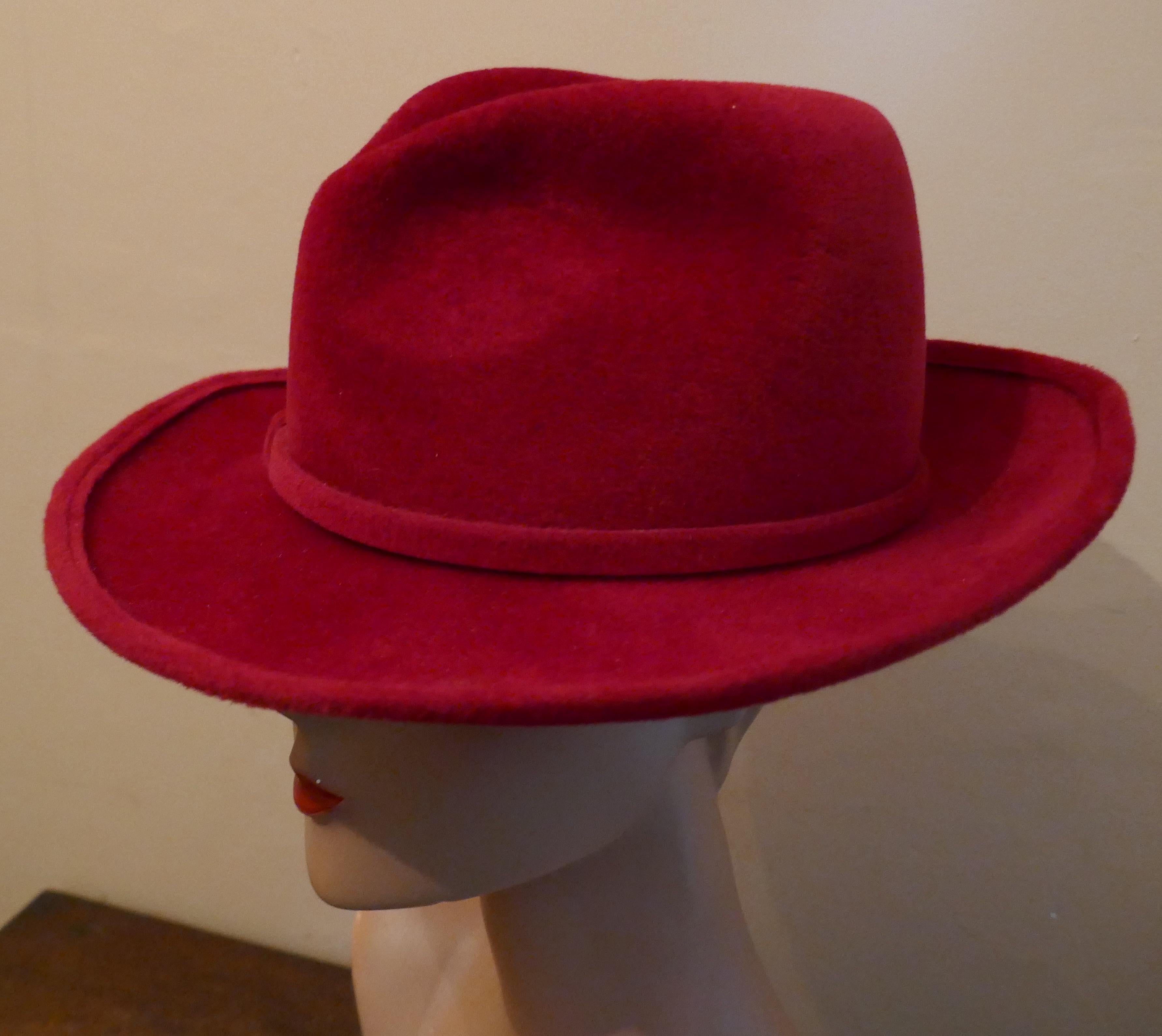 Original 1960s Red Fedora Style Hat designed by Marida

This gorgeous Hat is made 100% fur Felt, it has knotted band and a stitched brim
This one is an exquisite design wear it anywhere and be seen
The hat is  Designed by Marida, it is in good