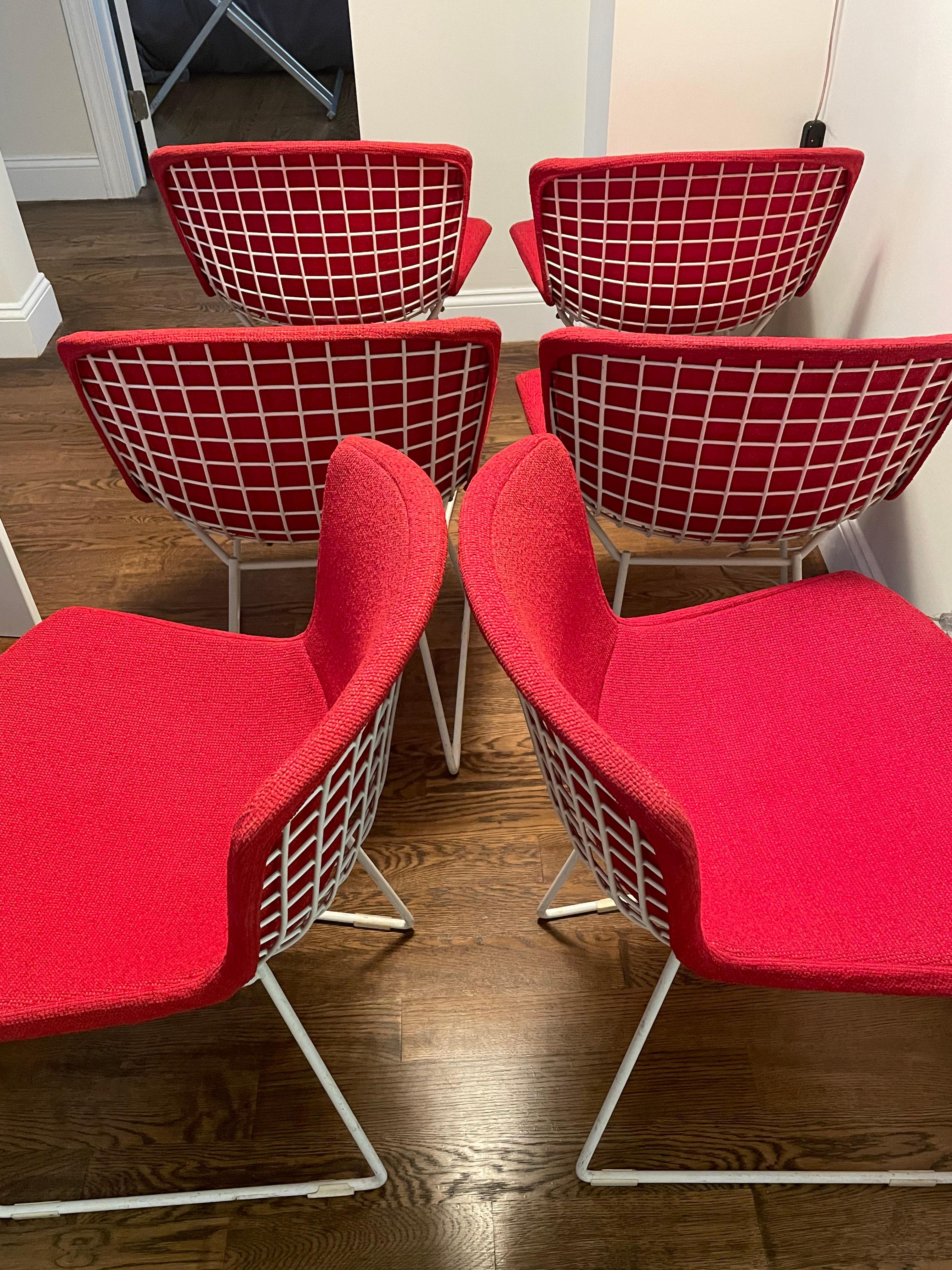 This gorgeous set was acquired from an original owner who bought the set of six chairs in 1968 from Knoll and I have a copy of the receipts. The chairs are covered in the original red knoll upholstery .They can be used with the covers or without the