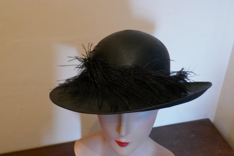 Original 1960s Shiny Black Panama Hat trimmed with Ostrich Feather In Good Condition For Sale In Chillerton, Isle of Wight