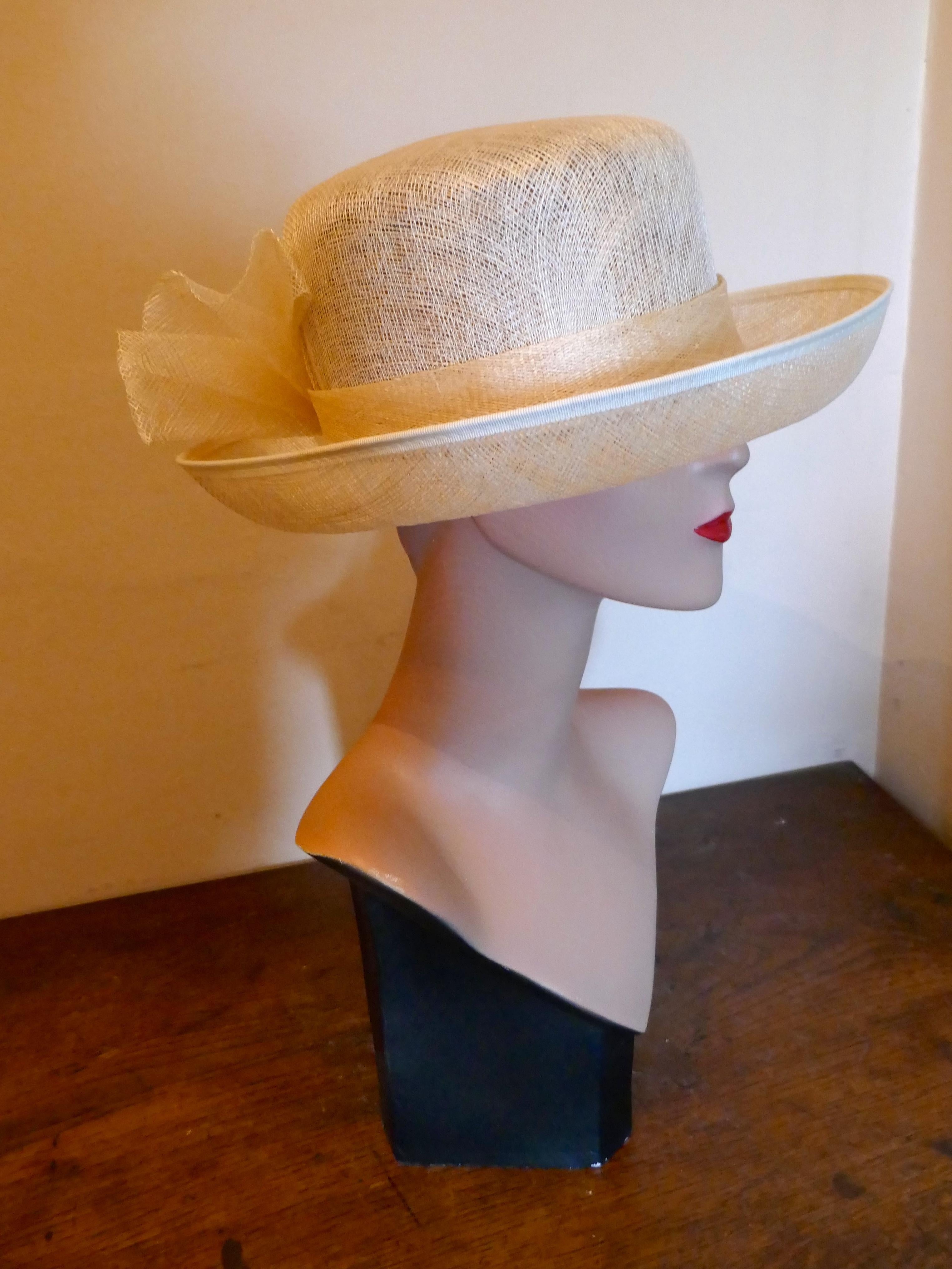 Original 1960s Straw Style Hat, Wimbledon, Garden Party 

This gorgeous Hat is very light and made with fine silky stiffened straw, it has beautiful large silk rose set in a large bow at the back 

This one is an exquisite design wear it anywhere