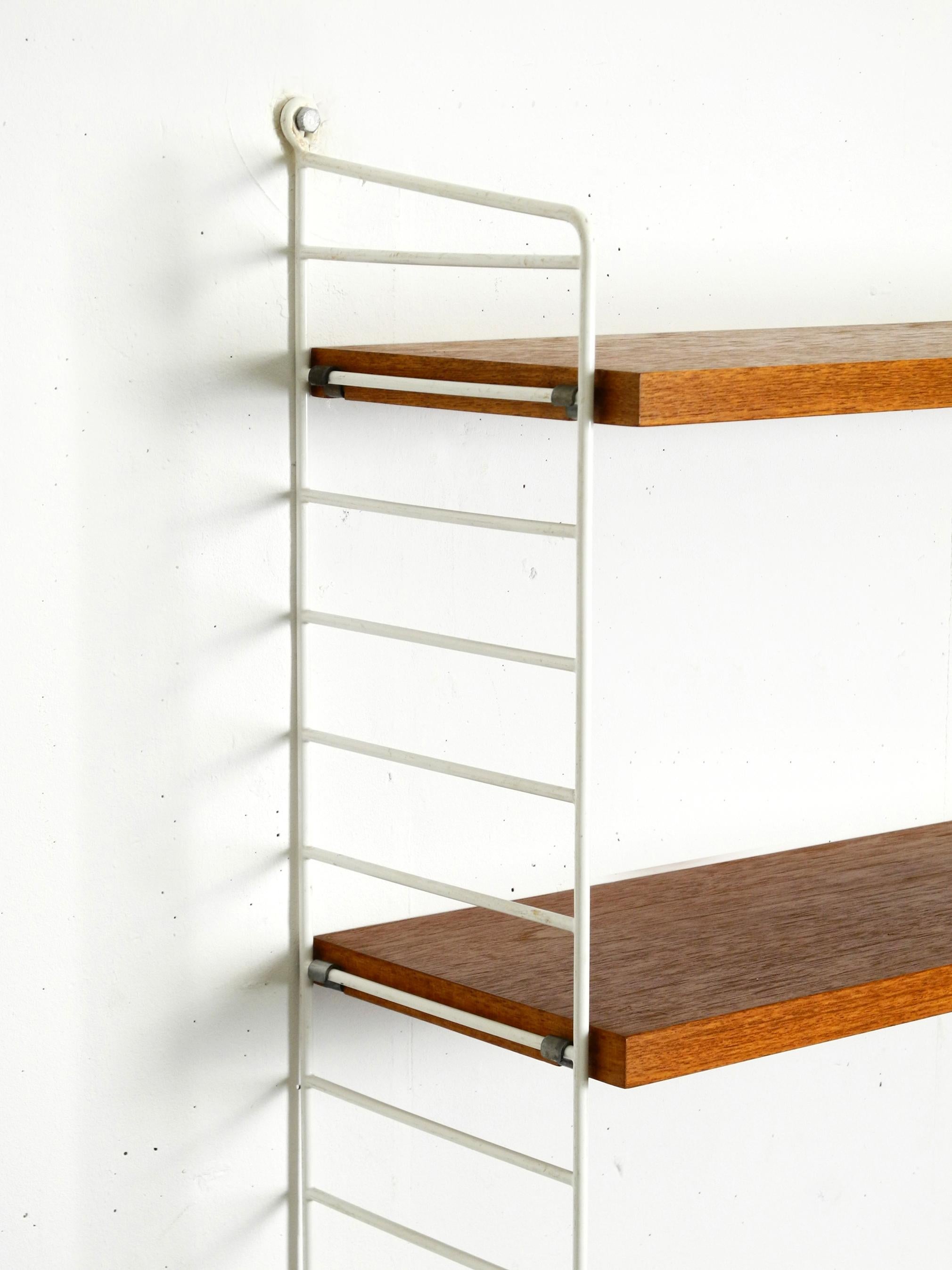 Original 1960s teak Nisse Strinning wall hanging shelf with 4 shelves 4