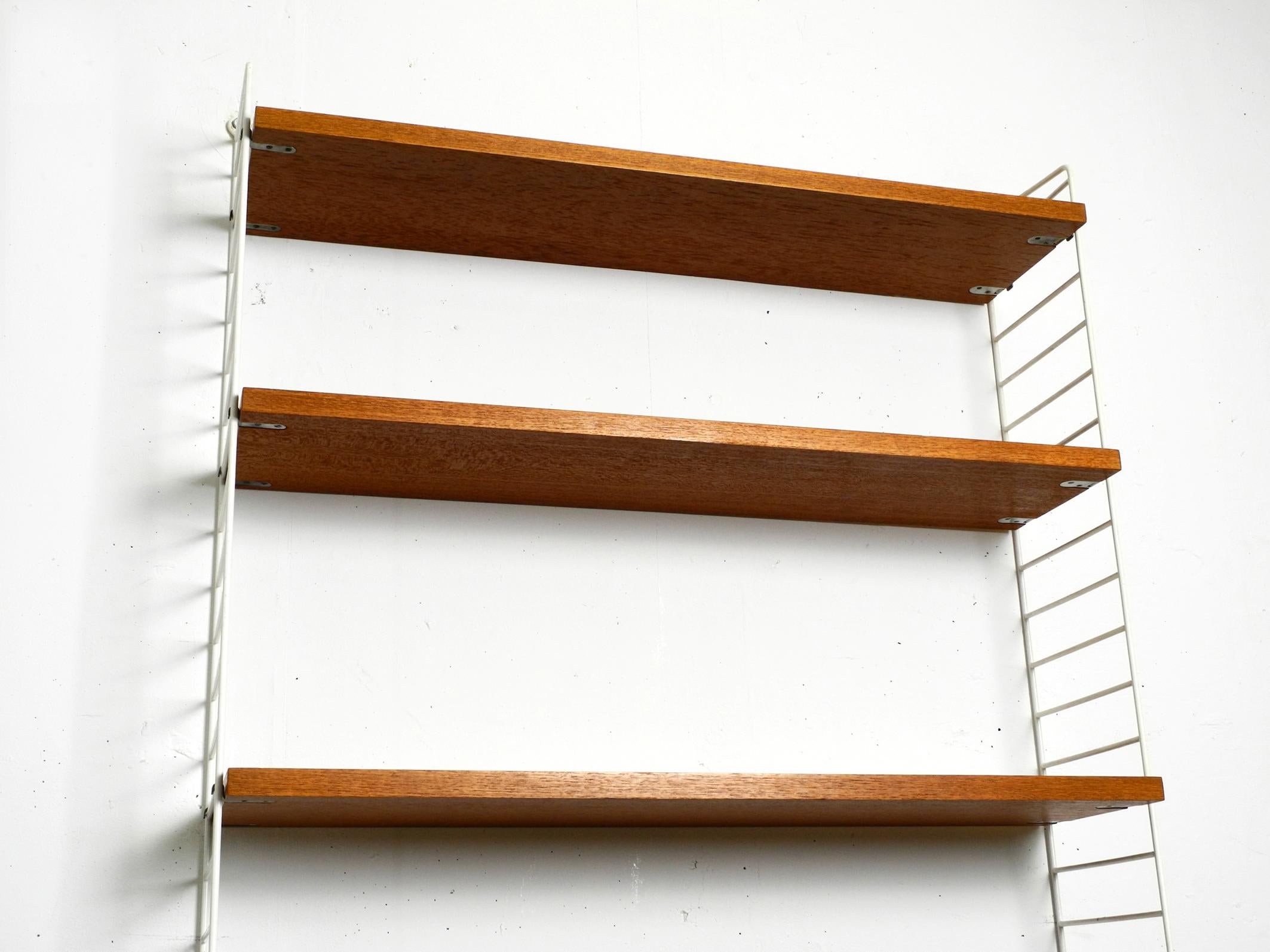 Original 1960s teak Nisse Strinning wall hanging shelf with 4 shelves 7