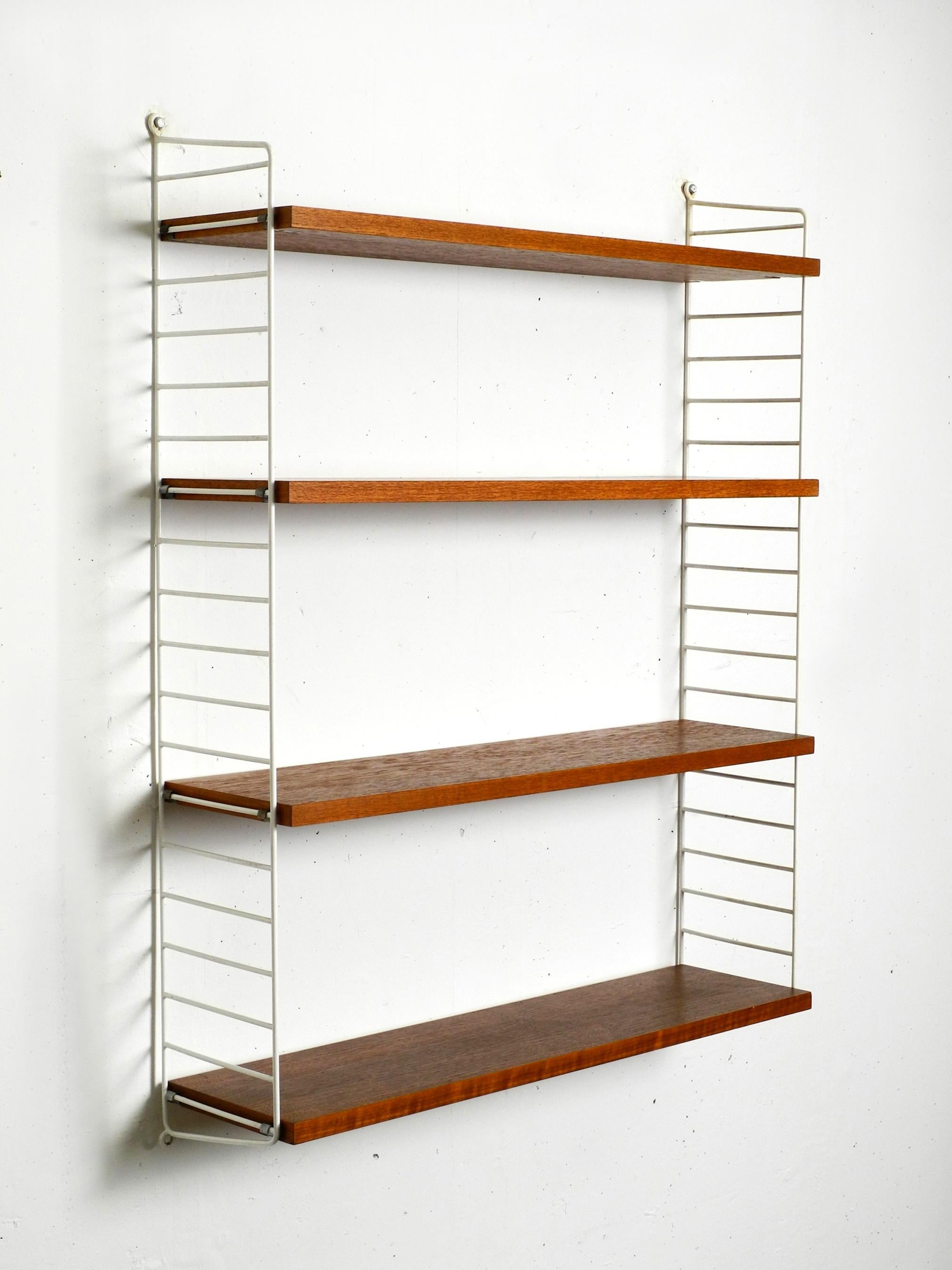 Danish Original 1960s teak Nisse Strinning wall hanging shelf with 4 shelves