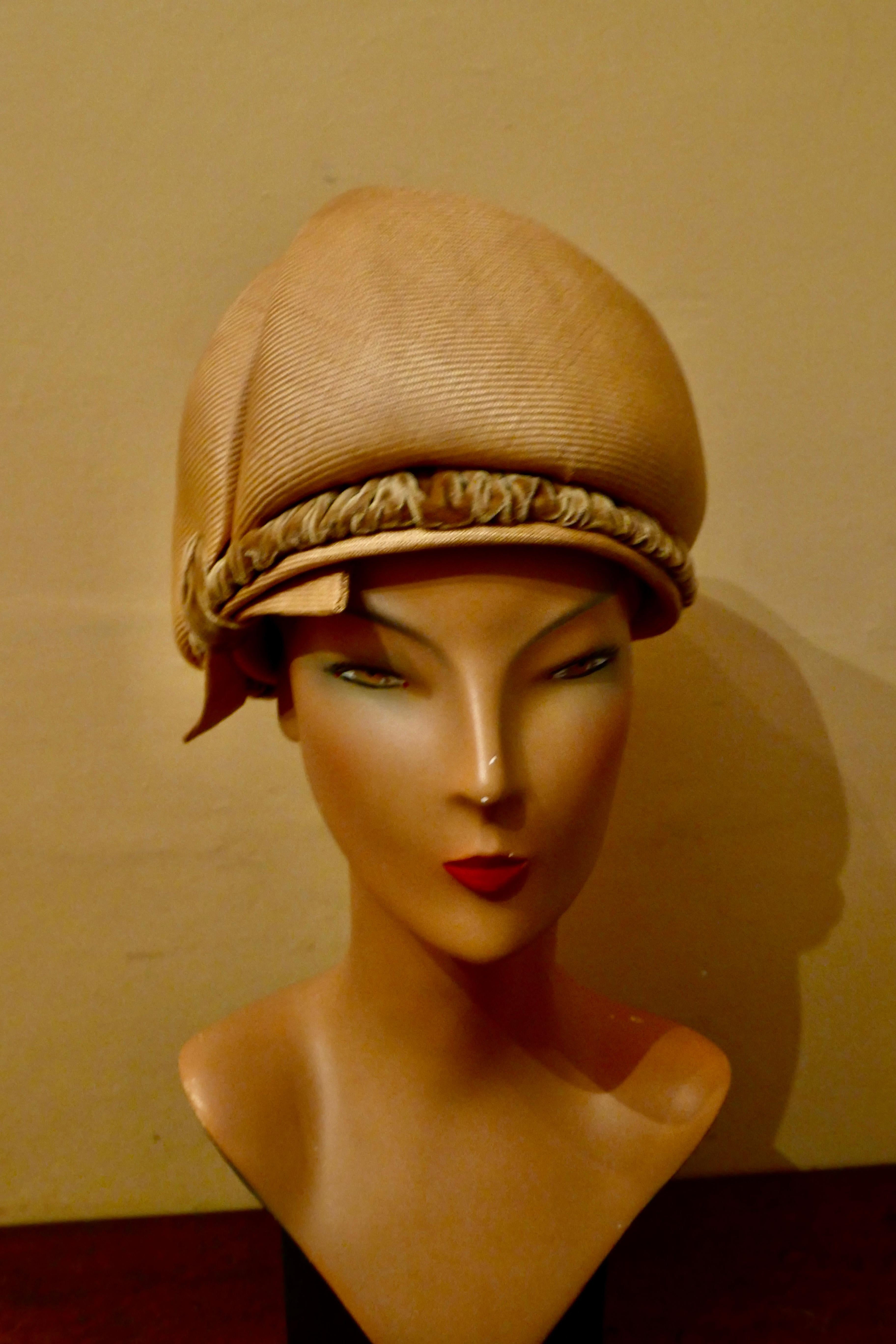 Original 1960s Vintage Pill Box Style High Moulded Straw Fabric Hat with velvet trim

This gorgeous Hat is made in crisp straw fabric, tall with a decorative spiral pleat and gathered velvet decoration 
The hat is  Designed by Connor, it is in good