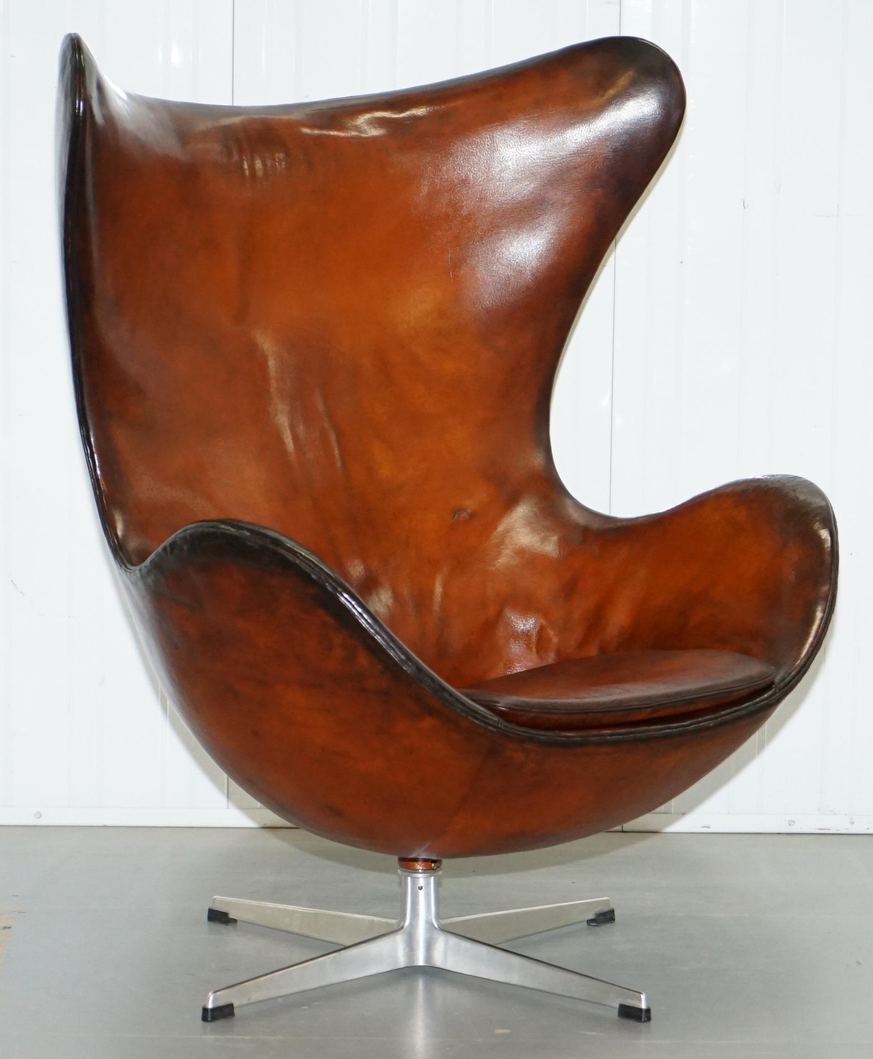 We are delighted to offer for sale this original, 1963 Firtz Hansen Arne Jacobson hand dyed whisky brown leather egg chair model number 3316

A rare find in restored condition, this piece is today considered art, it’s so sculptural and artistic,