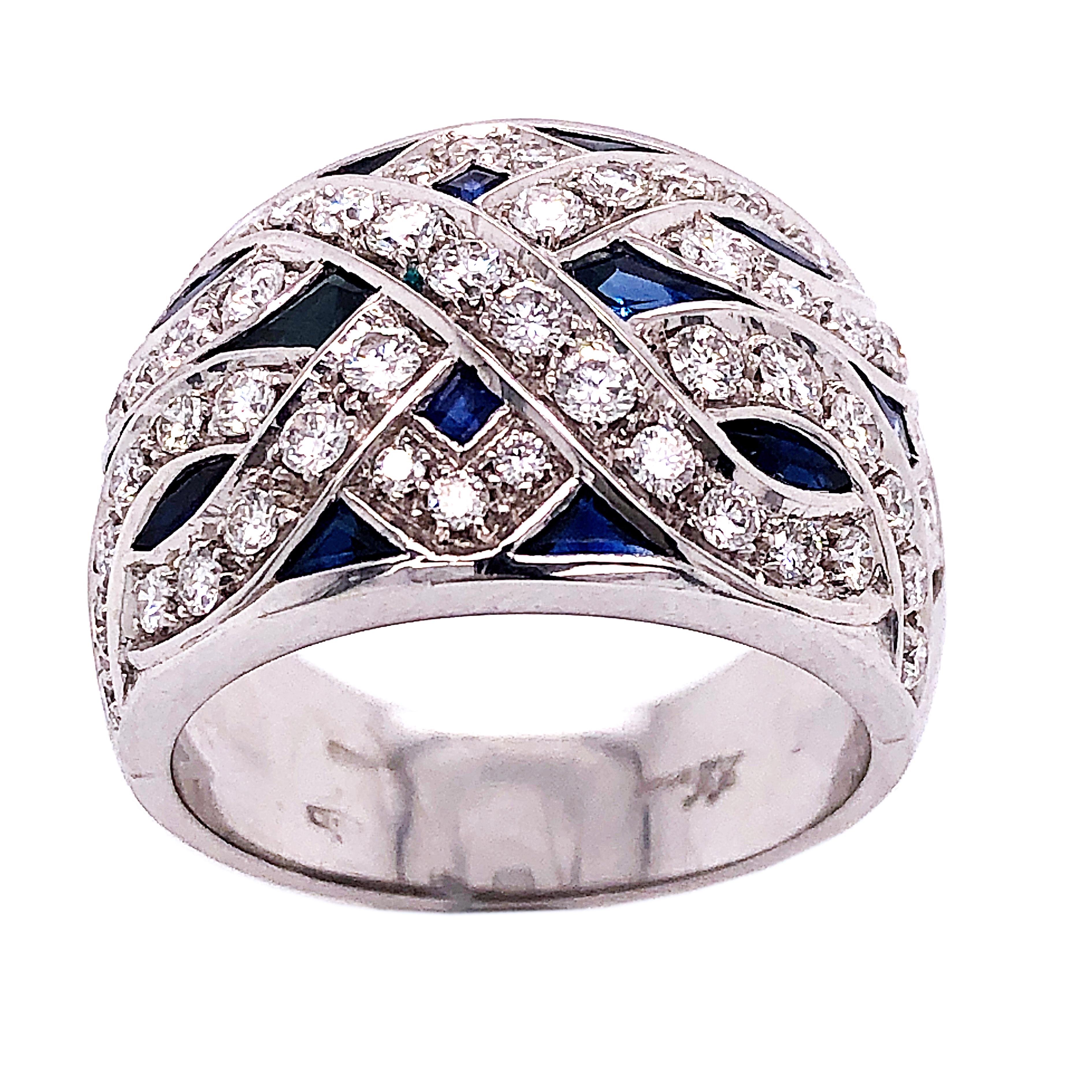 Original 1965 Chic yet Timeless One-of-a-kind Sumptuous Cocktail Ring featuring 3.90Kt Natural Hand Inlaid Blue Sapphire, 1.23 Carat White Diamond(D-E, VvS1) in an 18Kt White Gold setting.

Us Size 6 1/2
French size 53.5
We are pleased to offer