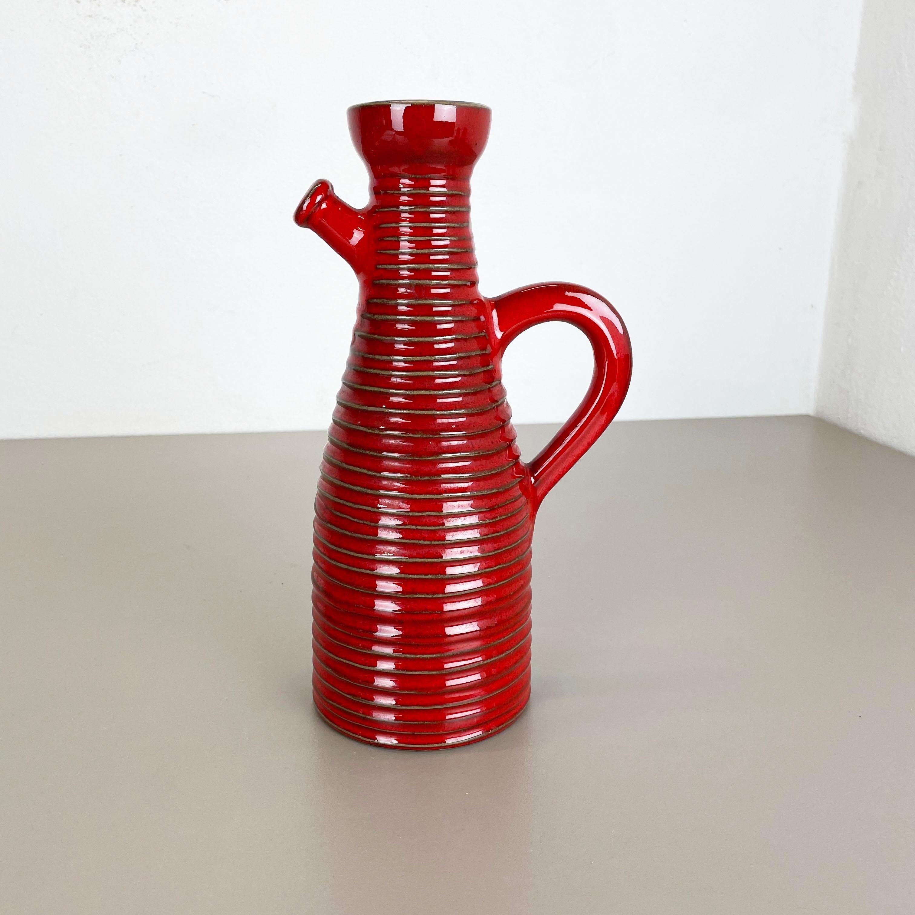 Article:

Ceramic fat lava 


Producer:

Marei Ceramics, Germany


Decade:

1970s



Original vintage Studio Pottery vase was produced in the 1970s by Marei Ceramics, Germany. The vase is made of pottery with a very nice red glaze
