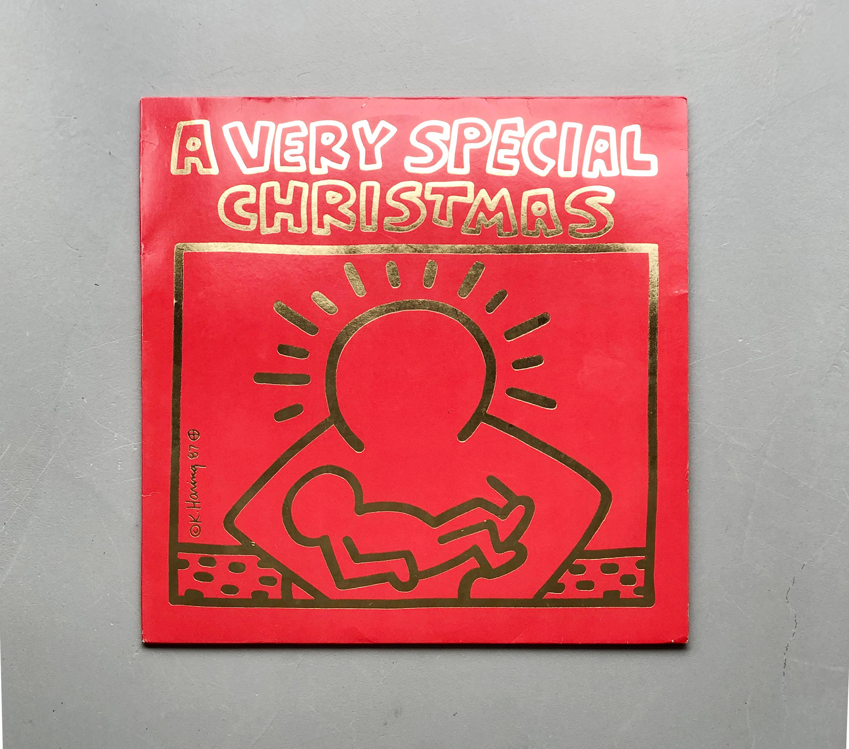 A Very Special Christmas 
Various artists
1987 first pressing vinyl record
A&M Records - SP-3911
Cover art by Keith Haring

This 1987 original pressing vinyl record showcases the distinctive artwork of Keith Haring and serves as the inaugural