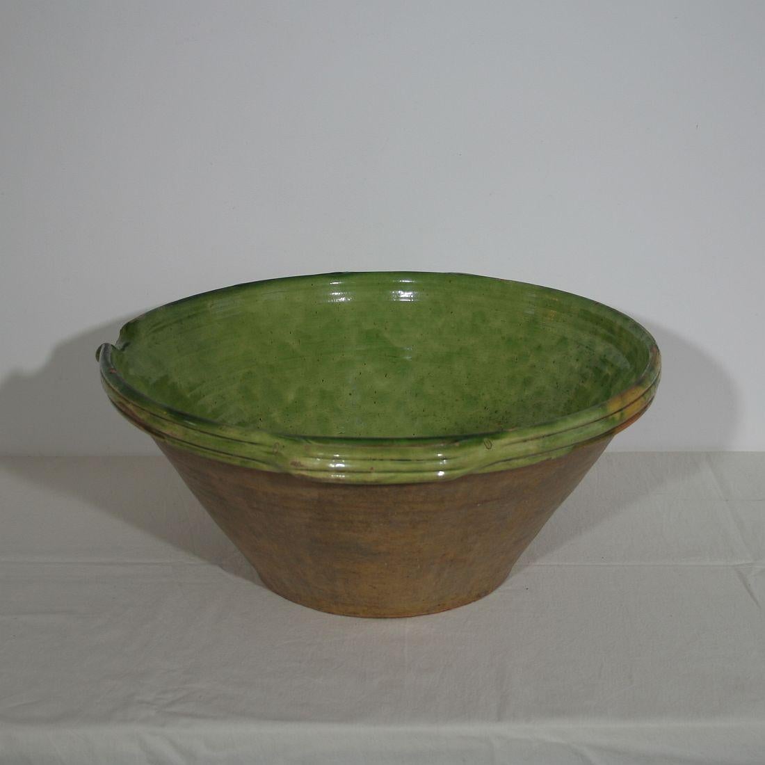 Fabulous antique French large tian (bowl) handmade from terracotta with an exceptional green color. Perfect for as a fruit bowl, as the perfect centerpiece with a bouquet of flowers, or alone as an awesome Country French accent. Tian is a word which
