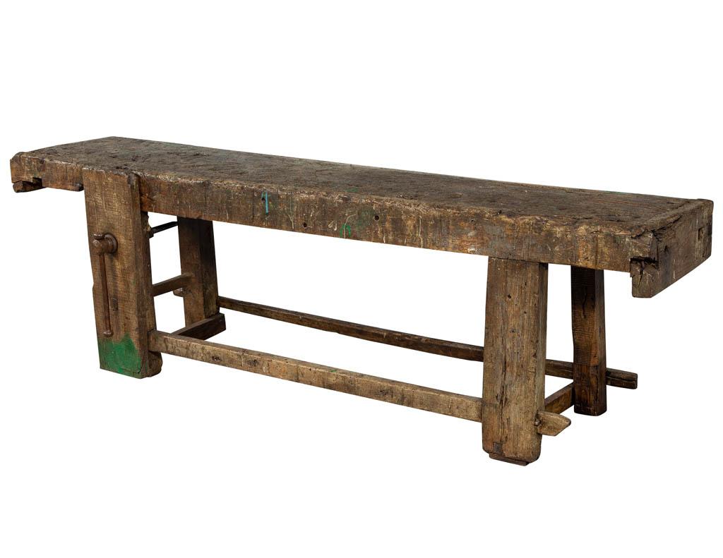 This original antique, rustic 19th century Tuscan craftsman work bench has amazing character. It is in its original condition; this piece makes a bold design statement in any setting. Has a functioning vise and shows years of hand loved wear.