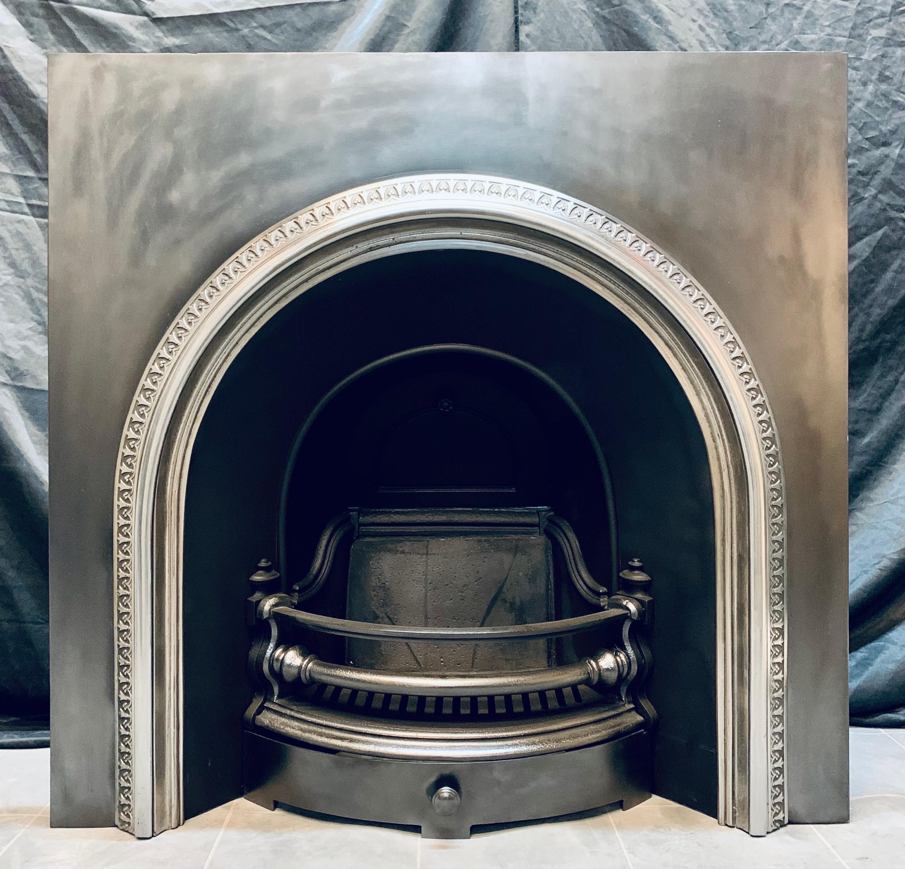 A fully original 19th Century Victorian Scottish Carron of Falkirk arched cast iron fireplace insert. A generous outer plate painted with heat proof black paint then graphite pasted. A highlighted and polished raised arched band displaying