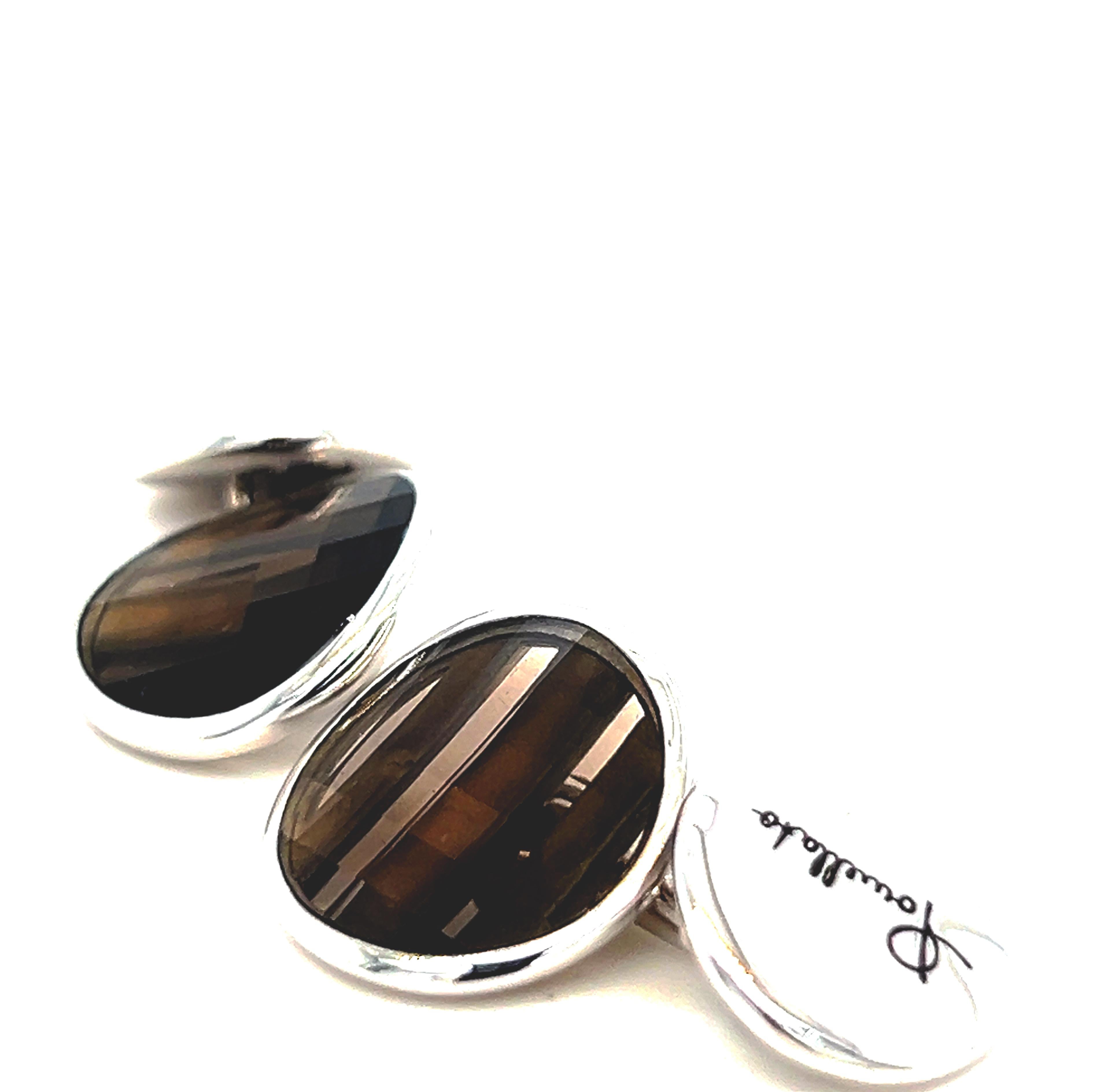 Original 2012, Faceted Smoky Quartz Pomellato Cufflinks, Sterling Silver White Gold Plated Setting(G.A921/AG9/QF).
This extremely versatile, wearable piece is perfect with any attire: Handcrafted in Sterling Silver and then White Gold Plated with