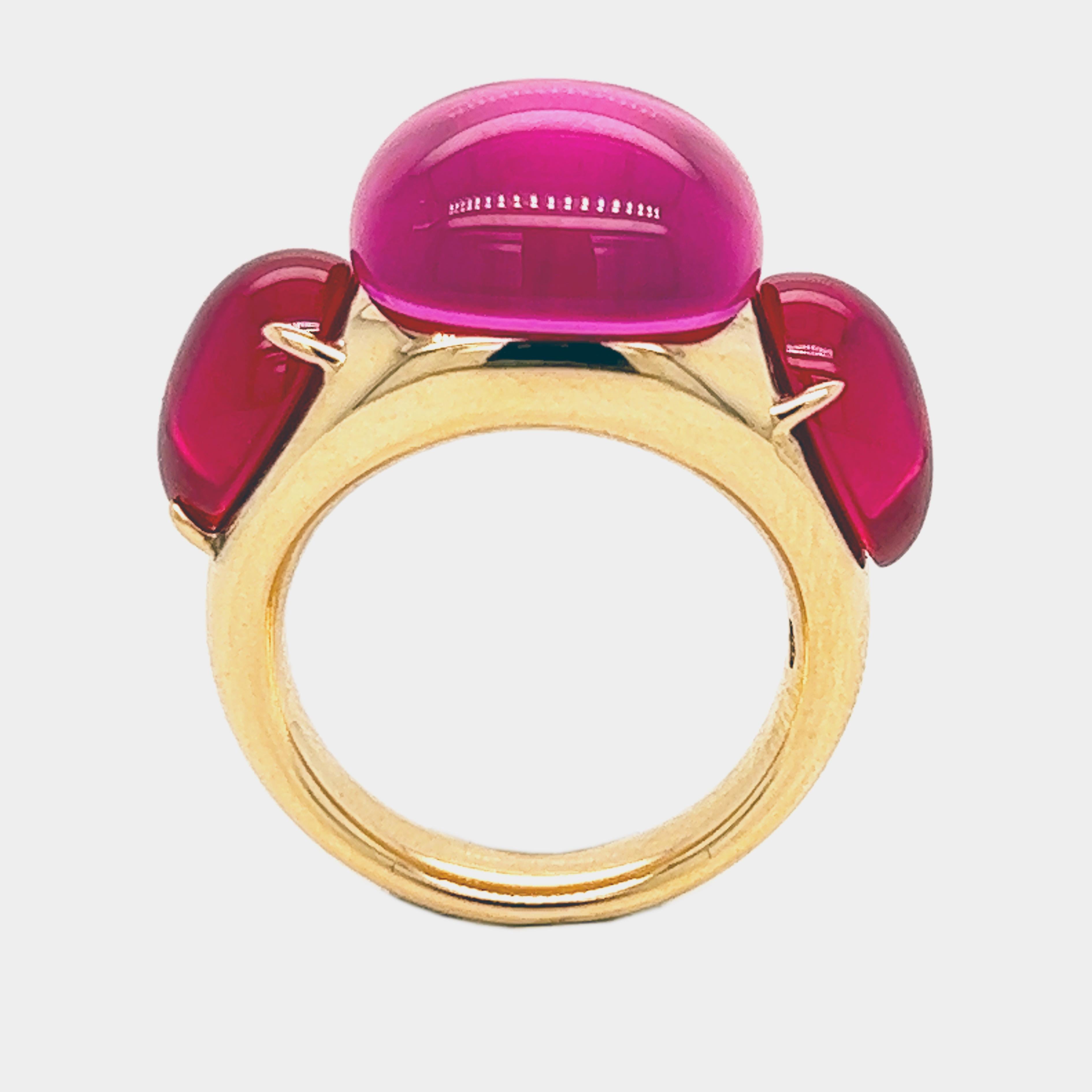 One-of-a-kind, 2013 Precious Hand Inlaid Cabochon Cut Pink Sapphire flanked by two Red Sapphire Cabochon Drop, Solid Rose Gold Setting(0.57OzT, 17.60g): this stunning piece is part of iconic Rouge Passion Collection.
A warm, feminine jewel inspired