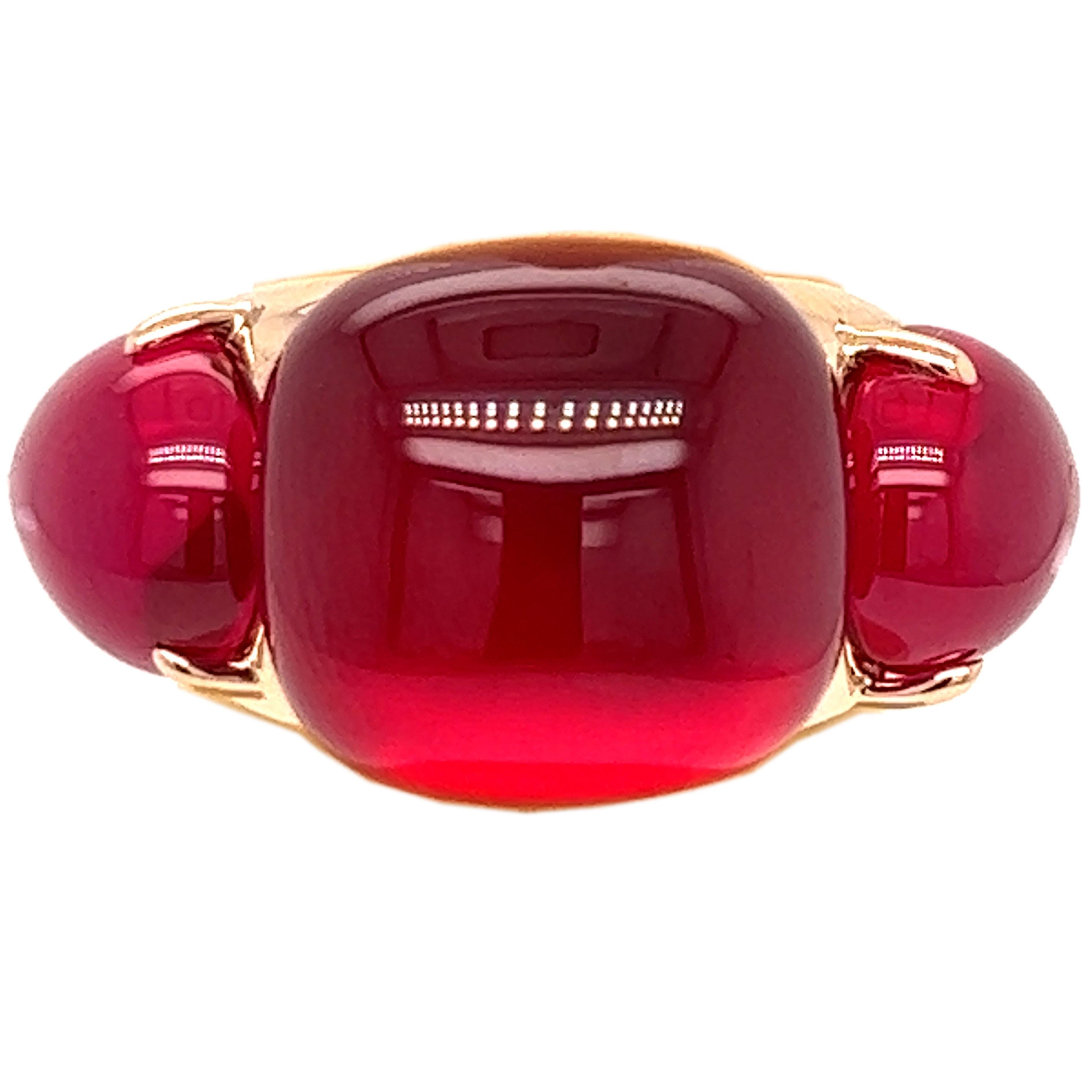 One-of-a-kind, 2013 Precious Hand Inlaid Cabochon Cut Red Sapphire flanked by two Red Sapphire Cabochon Drop, Solid Rose Gold Setting(0.52OzT, 16.10g): this stunning piece is part of iconic  Rouge Passion Collection.
A warm, feminine jewel inspired