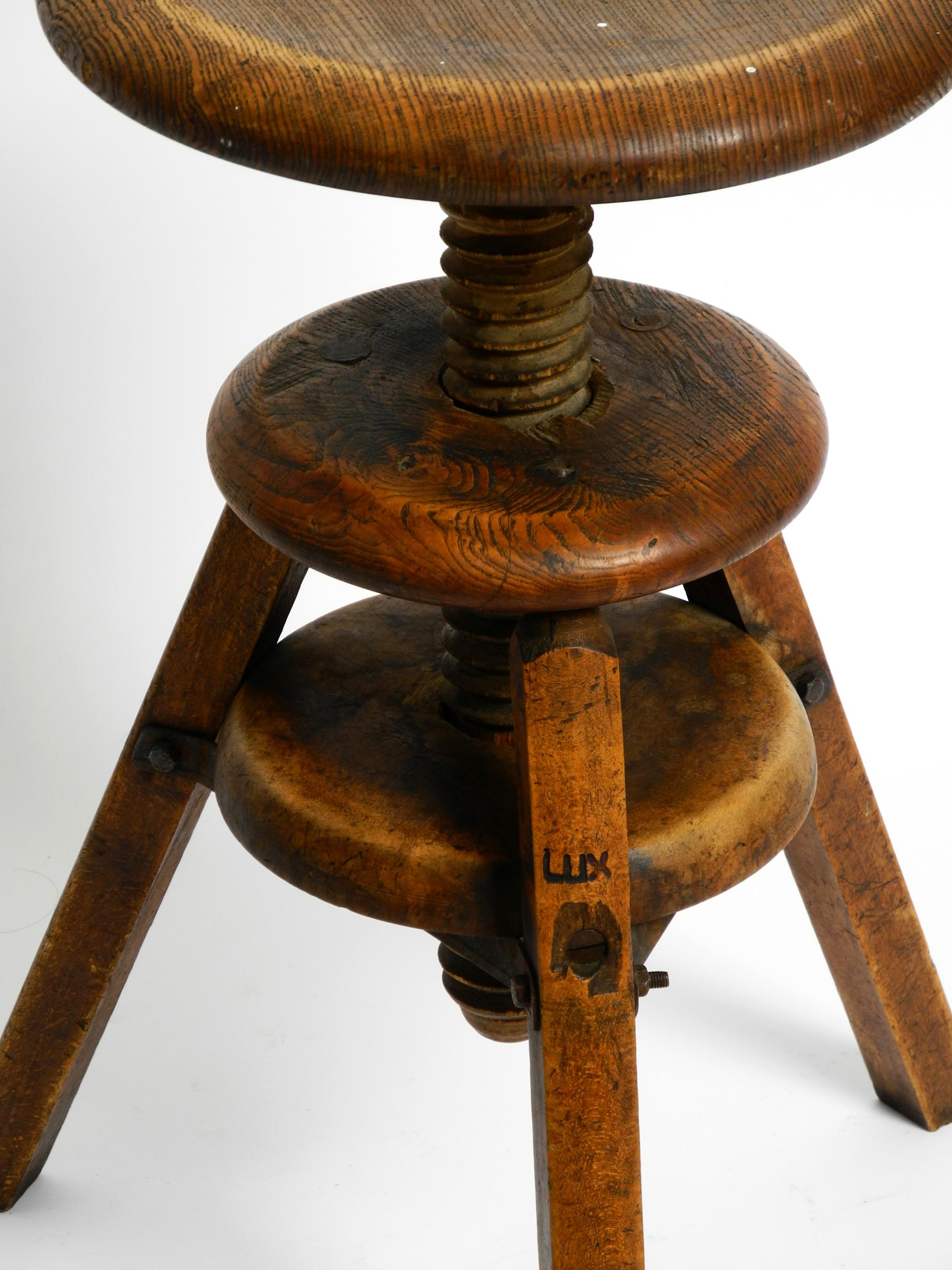 Original 30s French industrial swivel stool made of heavy oak 5