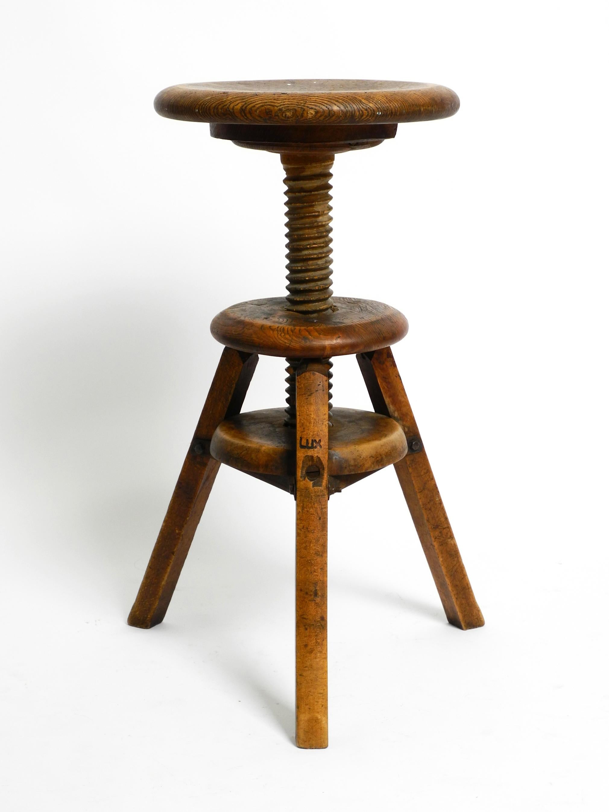 Original 30s French industrial swivel stool made of heavy oak 6
