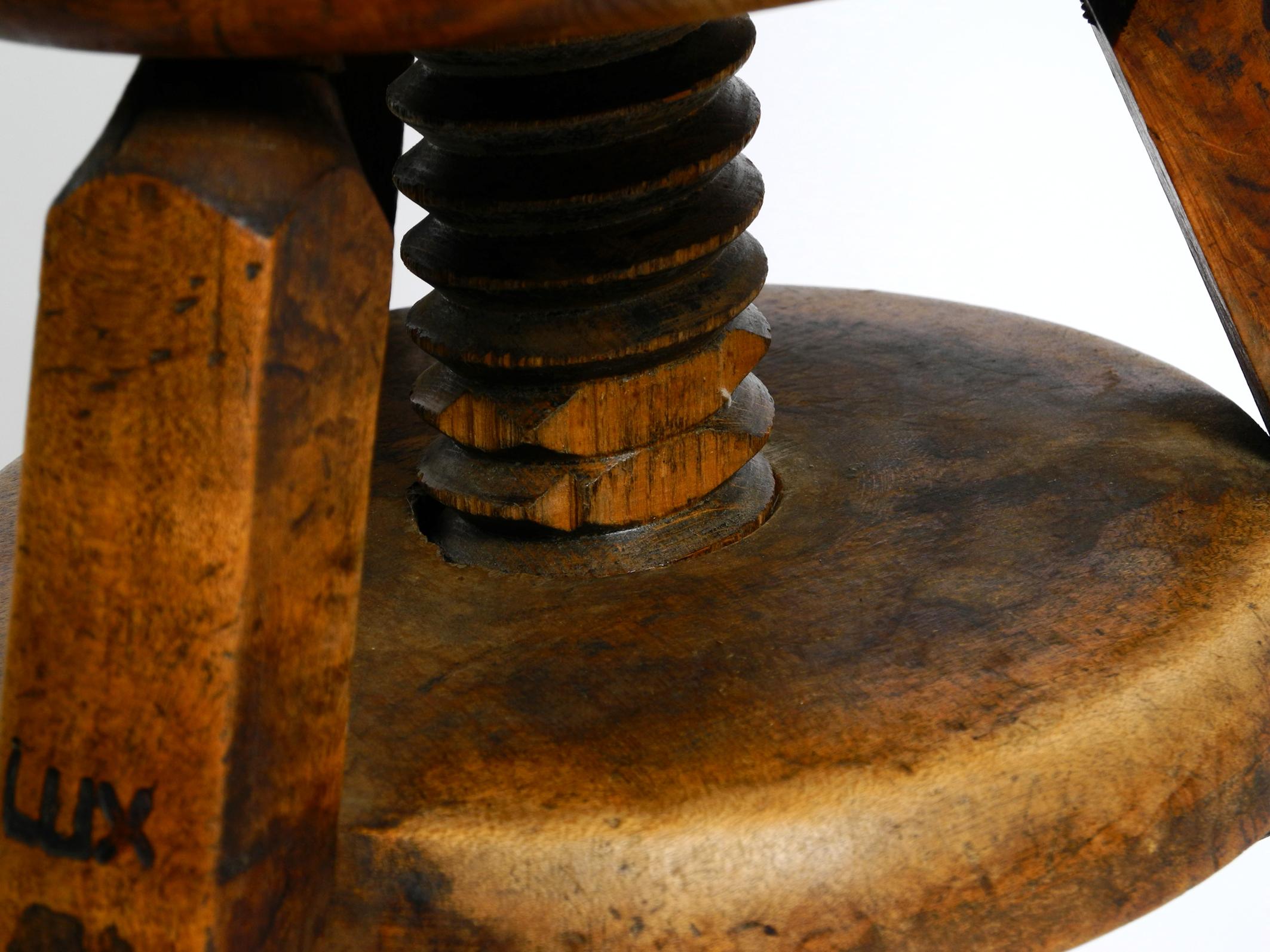 Original 30s French industrial swivel stool made of heavy oak 11