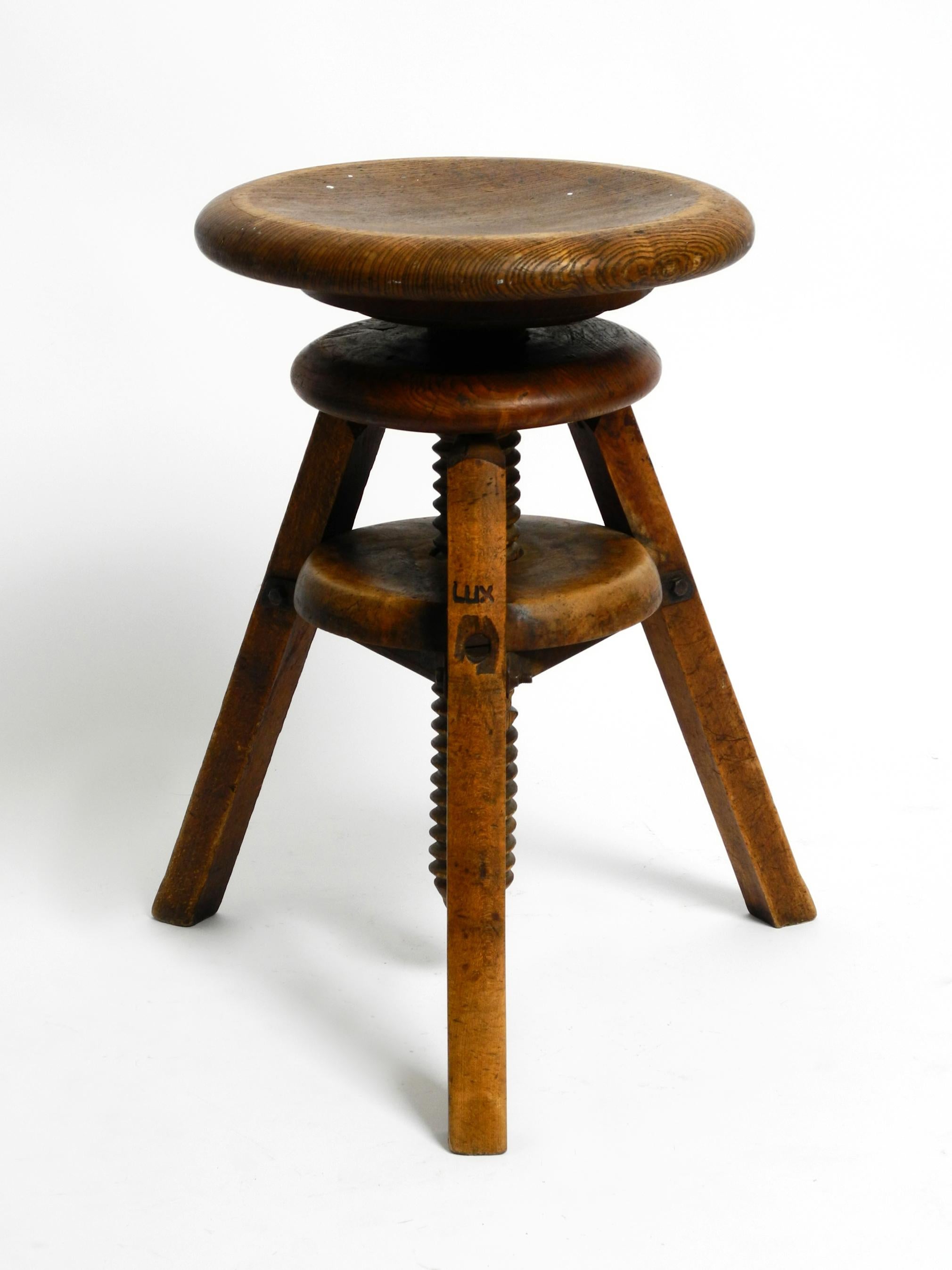 Mid-20th Century Original 30s French industrial swivel stool made of heavy oak