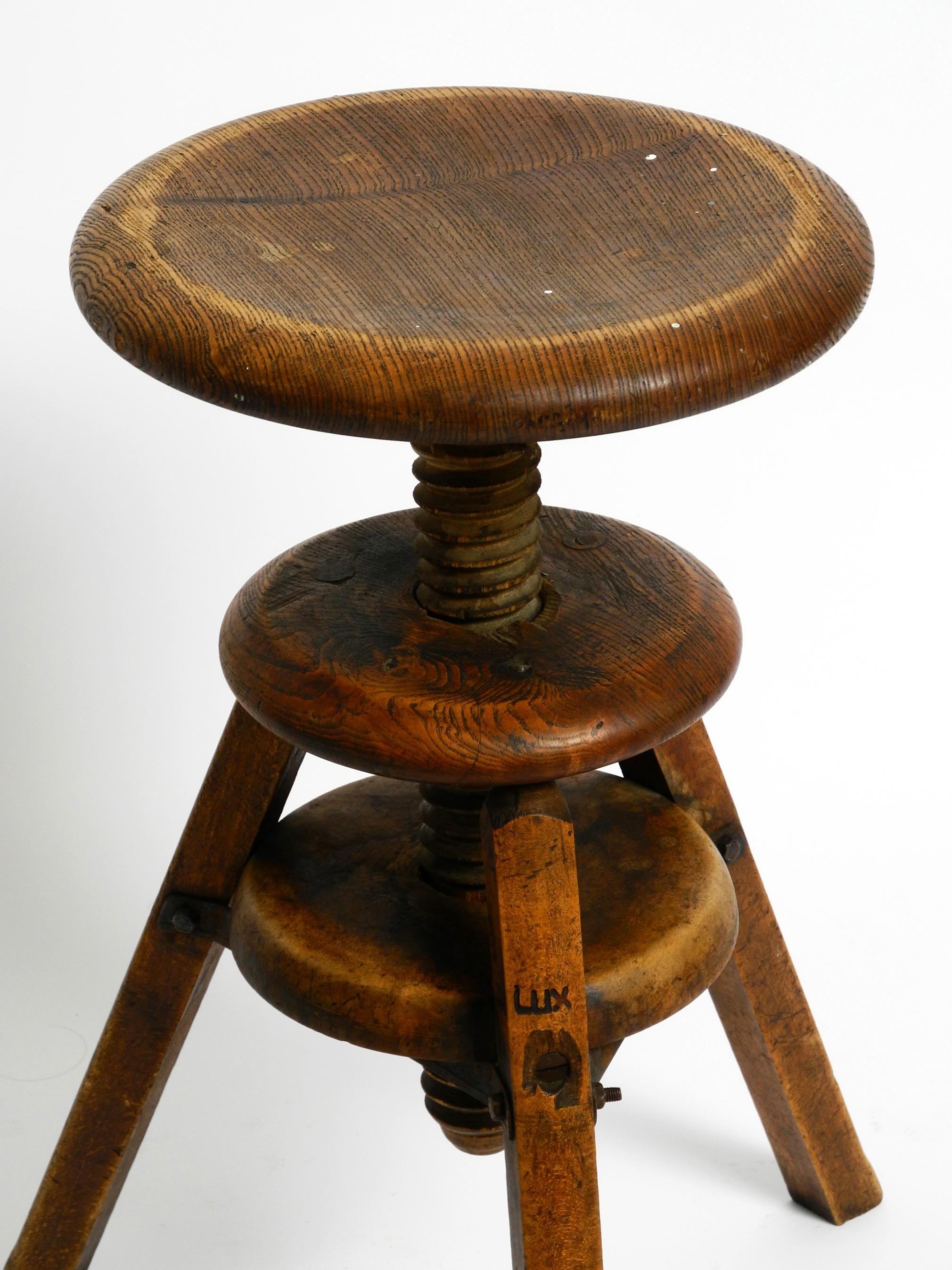 Metal Original 30s French industrial swivel stool made of heavy oak