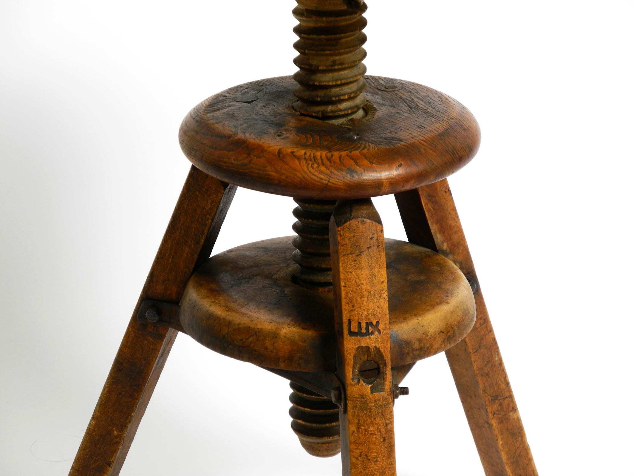 Original 30s French industrial swivel stool made of heavy oak 1