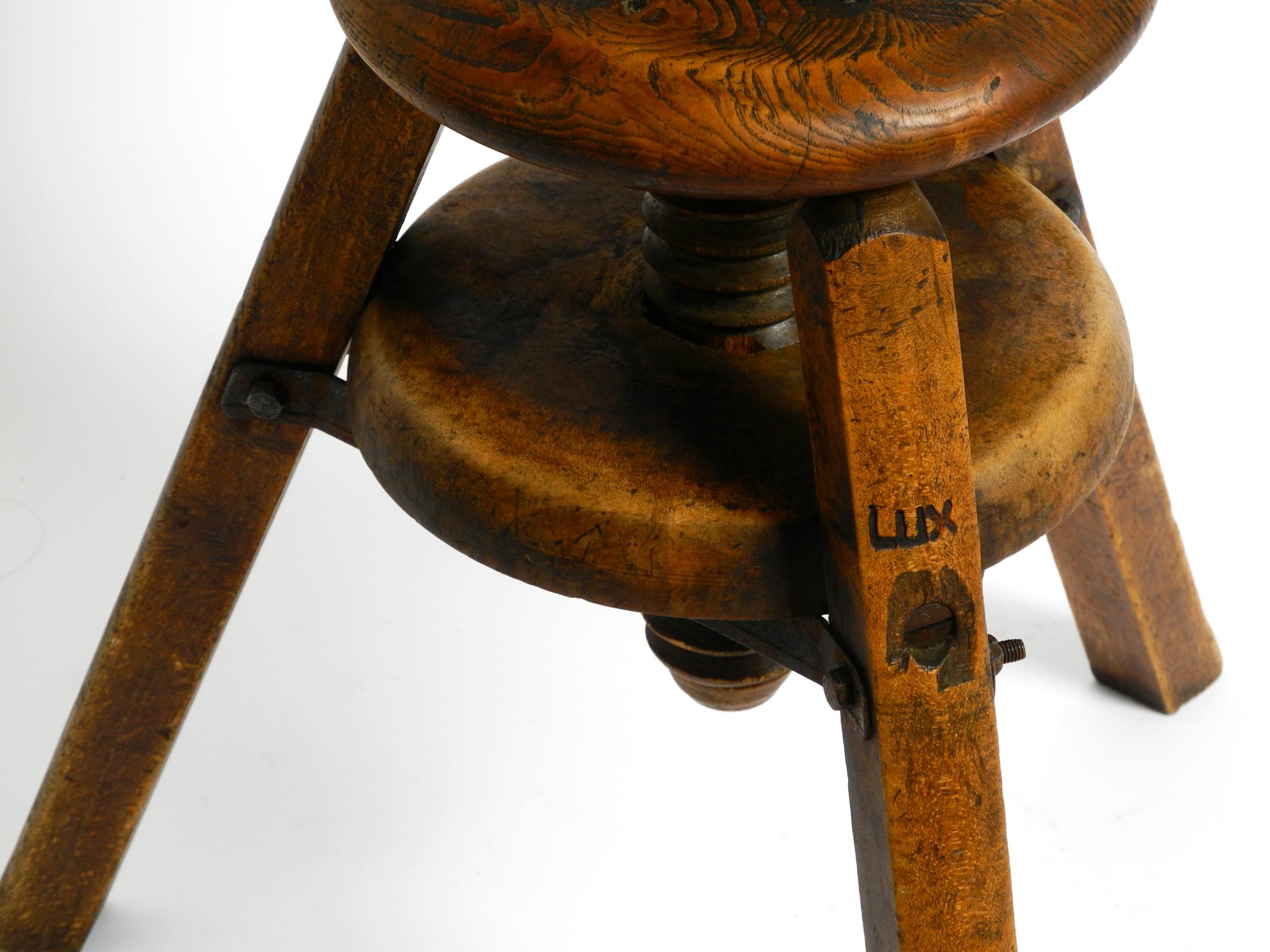 Original 30s French industrial swivel stool made of heavy oak 2