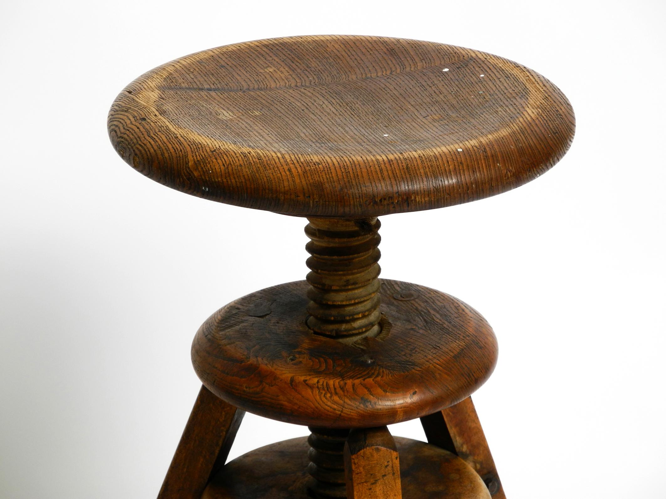 Original 30s French industrial swivel stool made of heavy oak 3