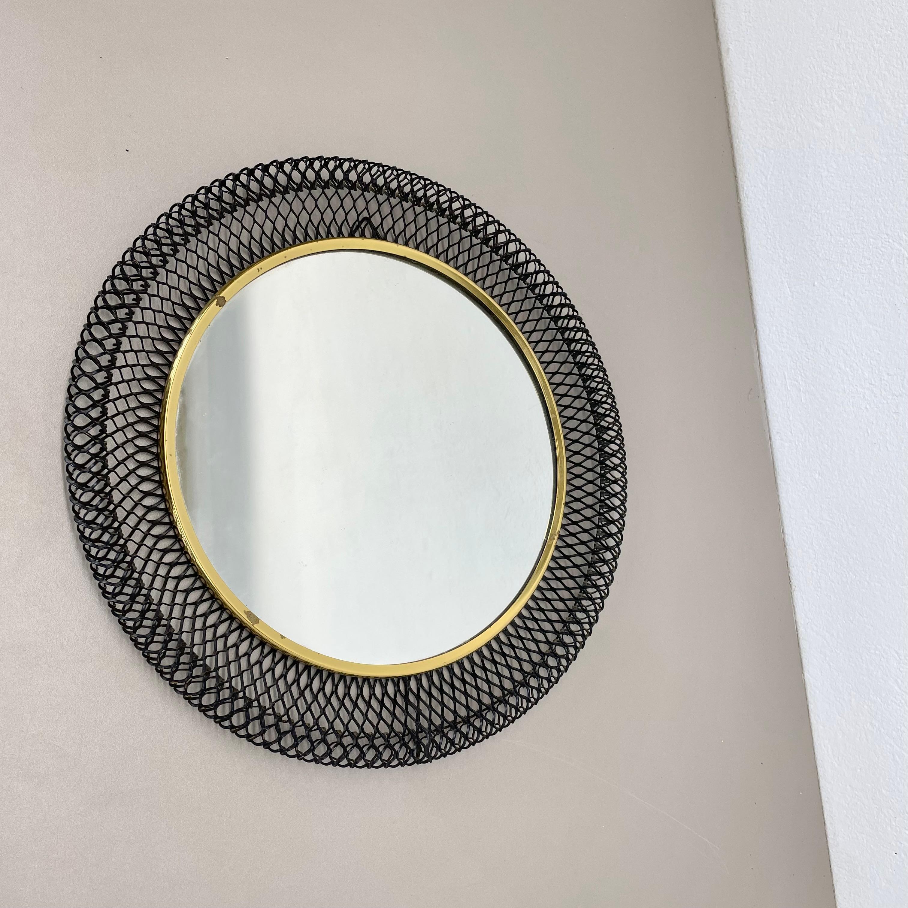 Article:

Wall mirror

Origin:

France

Design:

Remembers in design of Mategot

Age: 

1950s

This original vintage wall mirror was produced in the 1950s in France. it is made of solid metal with a metal grid perforation in white lacquered tone;