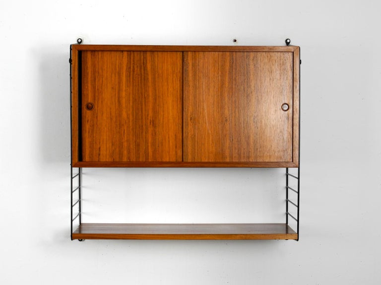 Original 1960s Nisse Strinning Teak String Shelf With Sliding Door