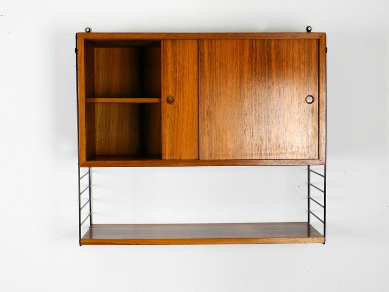 Original 1960s Nisse Strinning Teak String Shelf With Sliding Door
