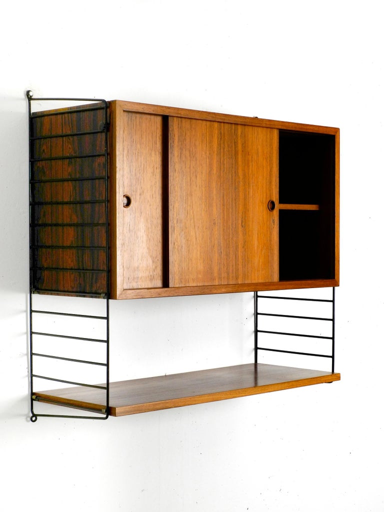 Original 1960s Nisse Strinning Teak String Shelf With Sliding Door