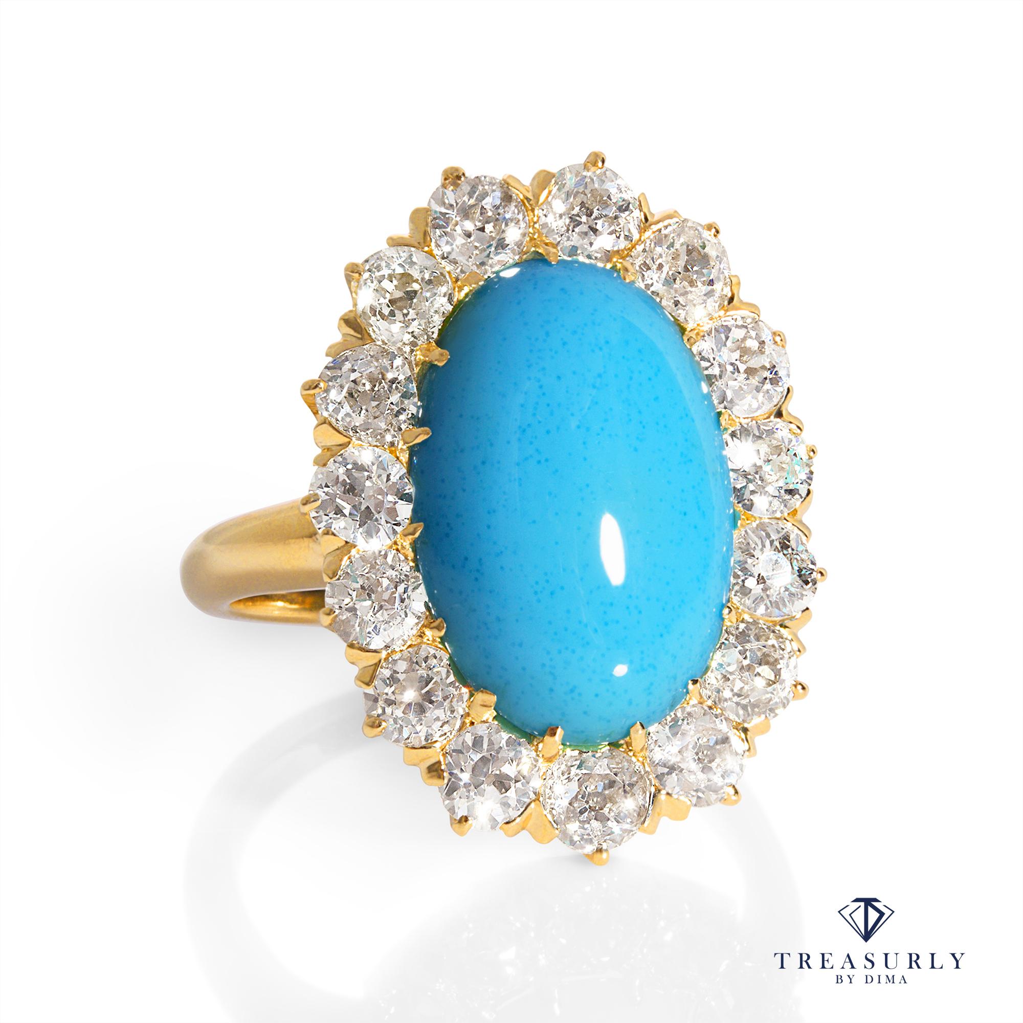 A Beautiful Authentic Classic VICTORIAN Turquoise and Diamonds Cluster Ring, hand-fabricated in 14K Yellow Gold, CIRCA 1890.  

A bright Turquoise oval cabochon centers a glittering halo of 15 OLD MINE Cut Diamonds in this stunning Late Victorian