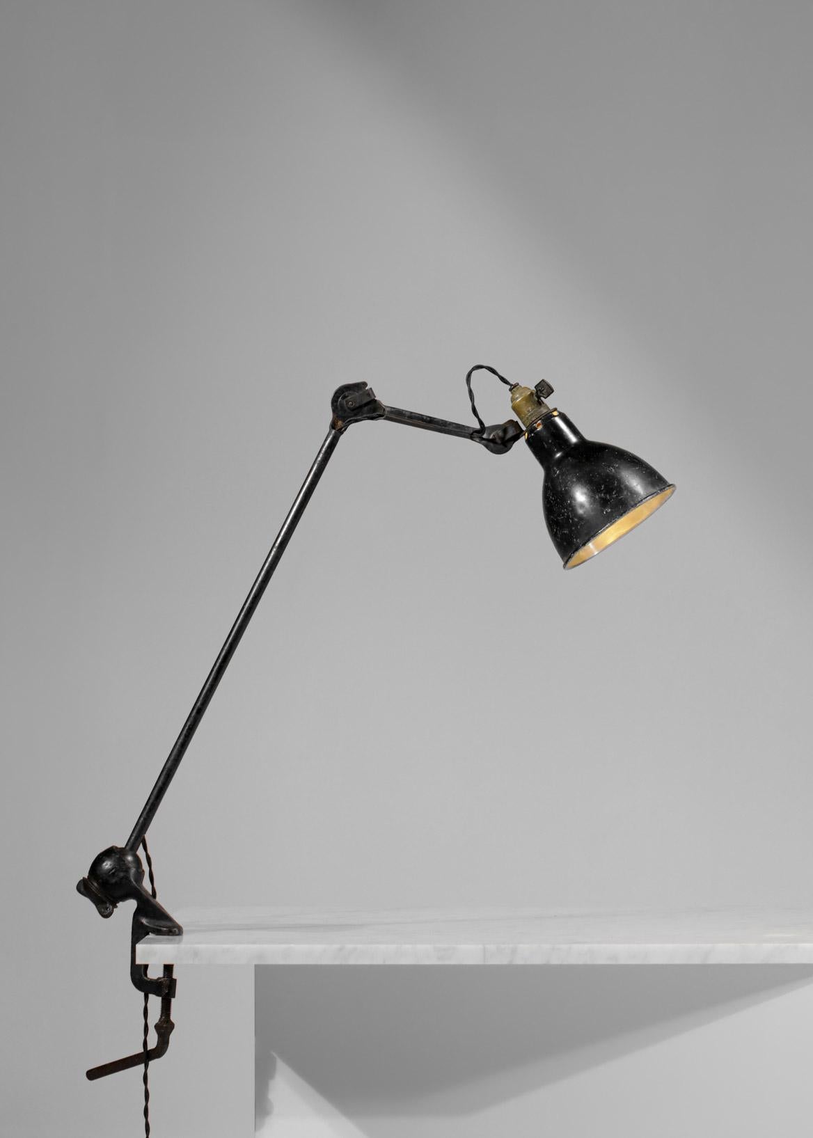 French workshop lamp created by Albert Albin Gras in the 1950s. Metal structure, lampshade and articulated arms. The 
