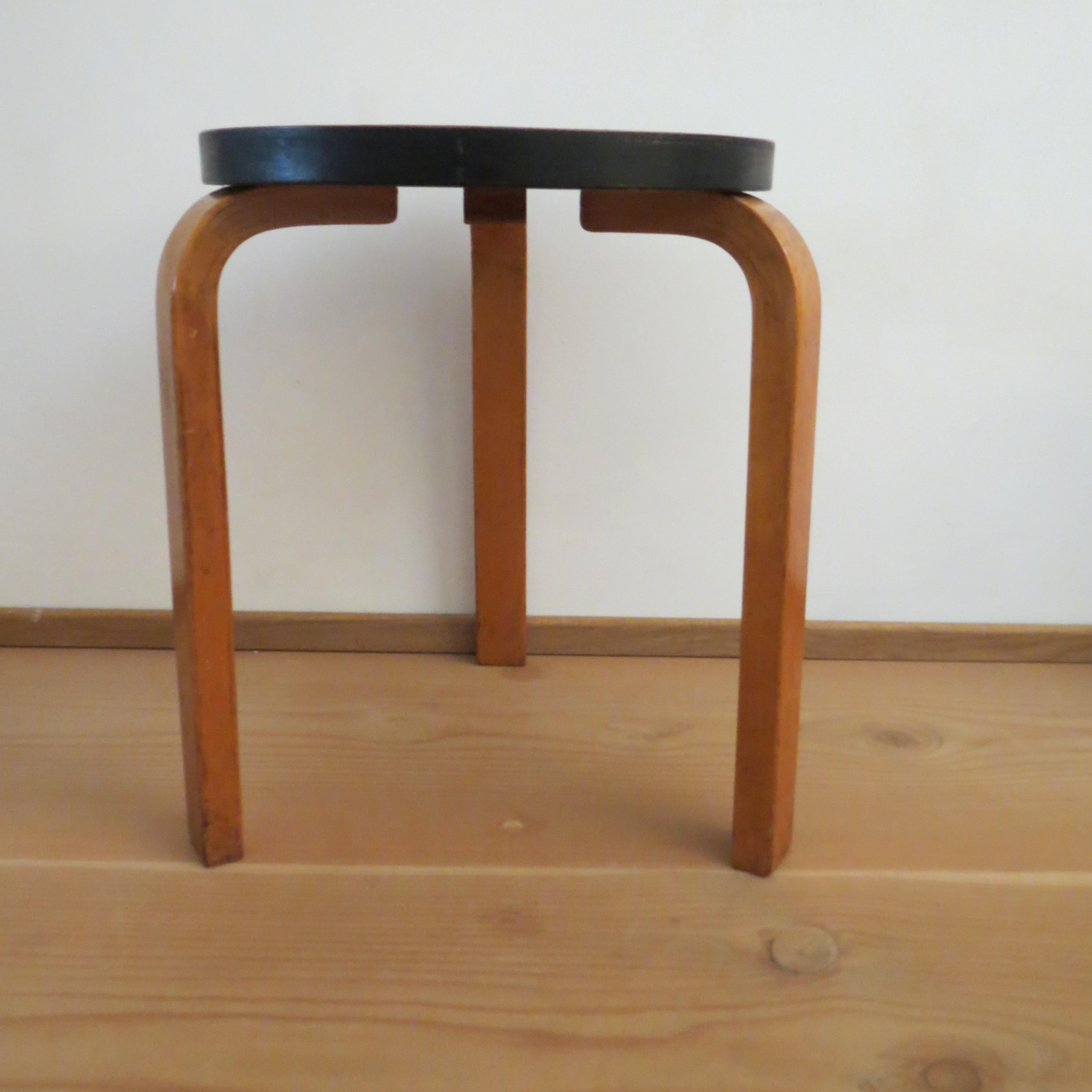 Wonderful, early stool designed by Alvar Aalto for Finmar, Finland. Originally designed 1933, this is an early edition, from the 1930s or 1940s.
Retains the original finish including ebonized edge to the seat of the stool which appears to be