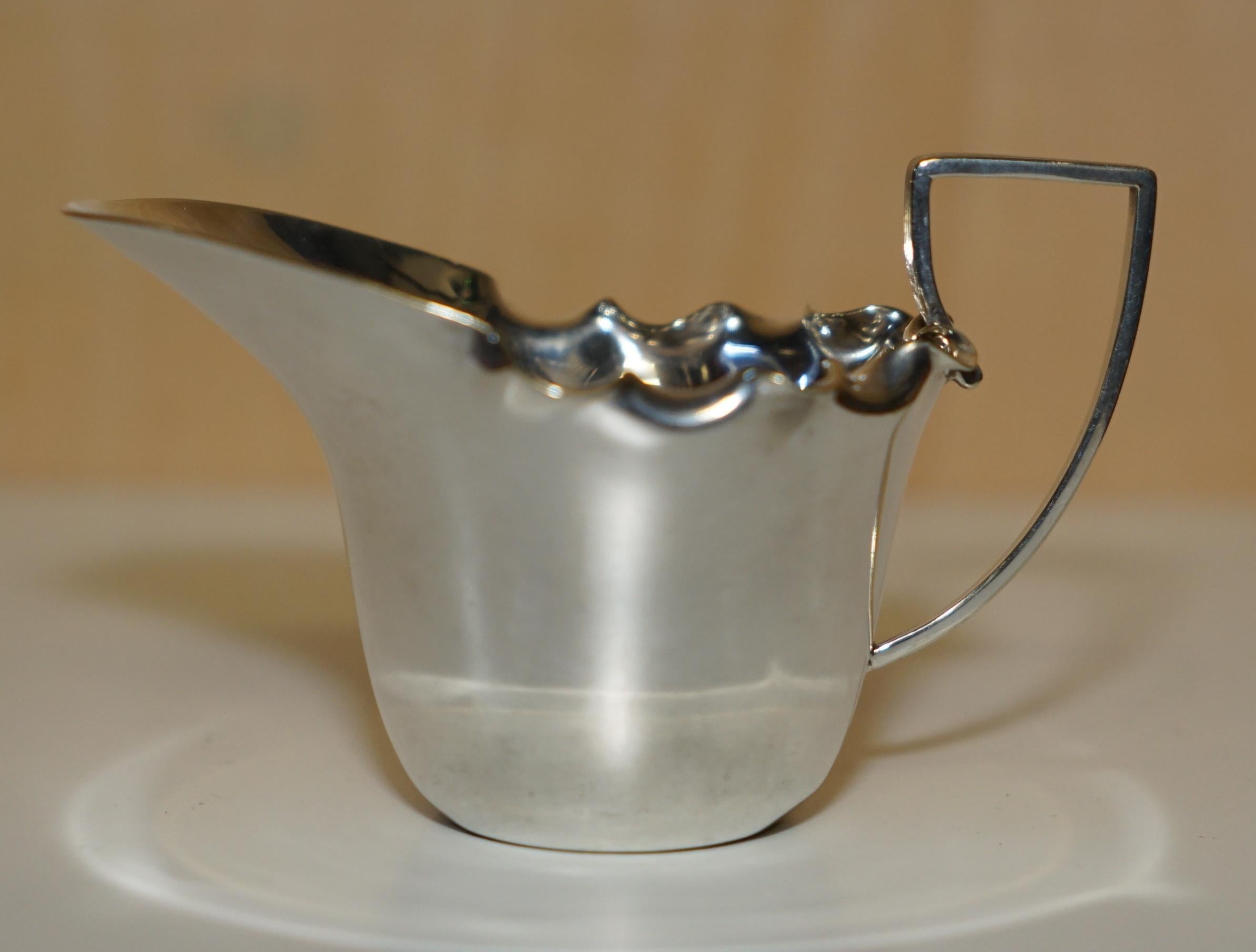Royal House Antiques

Royal House Antiques is delighted to offer for sale this lovely original antique fully hallmarked Daniel & Arter Silver Plated Milk or Cream jug in A1 plate

A very good looking and usable piece, it has been nicely polished and