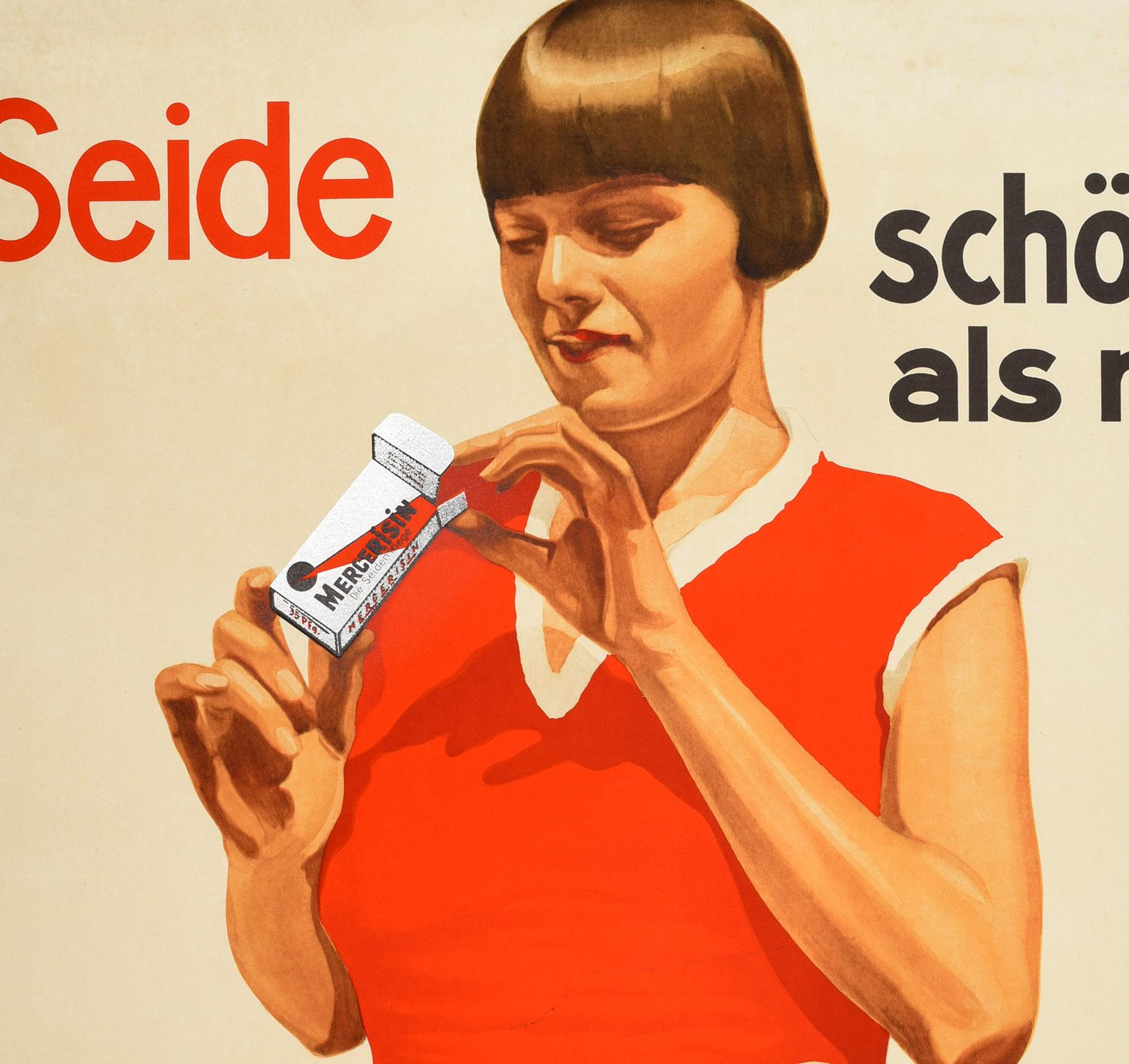 Original antique advertising poster for Mercerisin cleaning soap featuring a lady holding a packet of Mercerisin with her laundry in a washing bowl, the bold text in red and black reading - Seide schoner als neu! durch Mercerisin die Seidenflege fur
