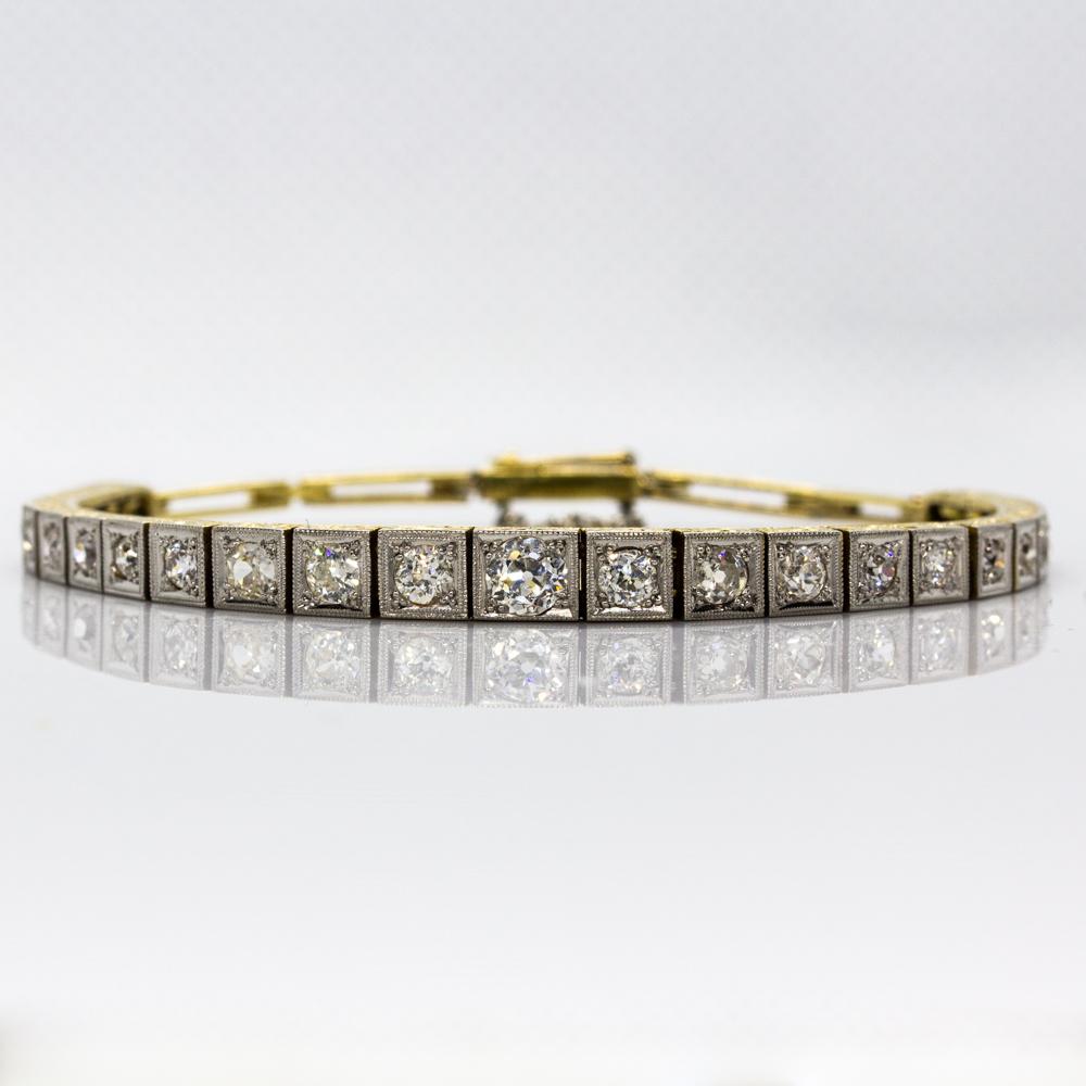 Composition: 18k Gold & Platinum
Period: Art Deco

•	27 old mine cut diamonds I-SI1 2.20ctw.

Total weight: 13.9 grams – 8.9dwt

