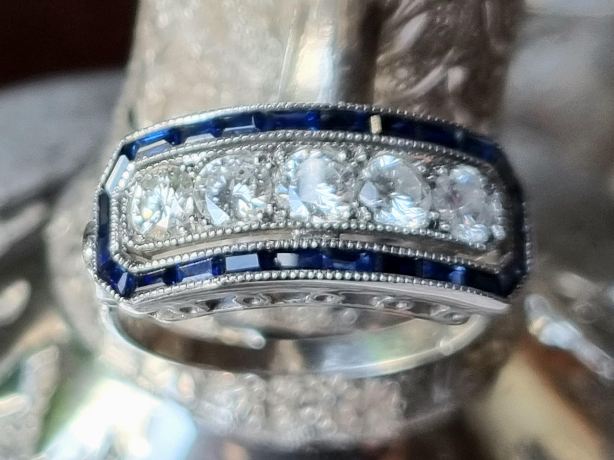 Original Antique Art-Deco Diamond Five Stone and Calibre Sapphire Ring 1920s
Mounted and tested in Platinum. This ring is wonderly handmade with 5 Old European-cut Diamonds weighing approx. 0.65 carats and rectangular calibre sapphires approx. 0.45