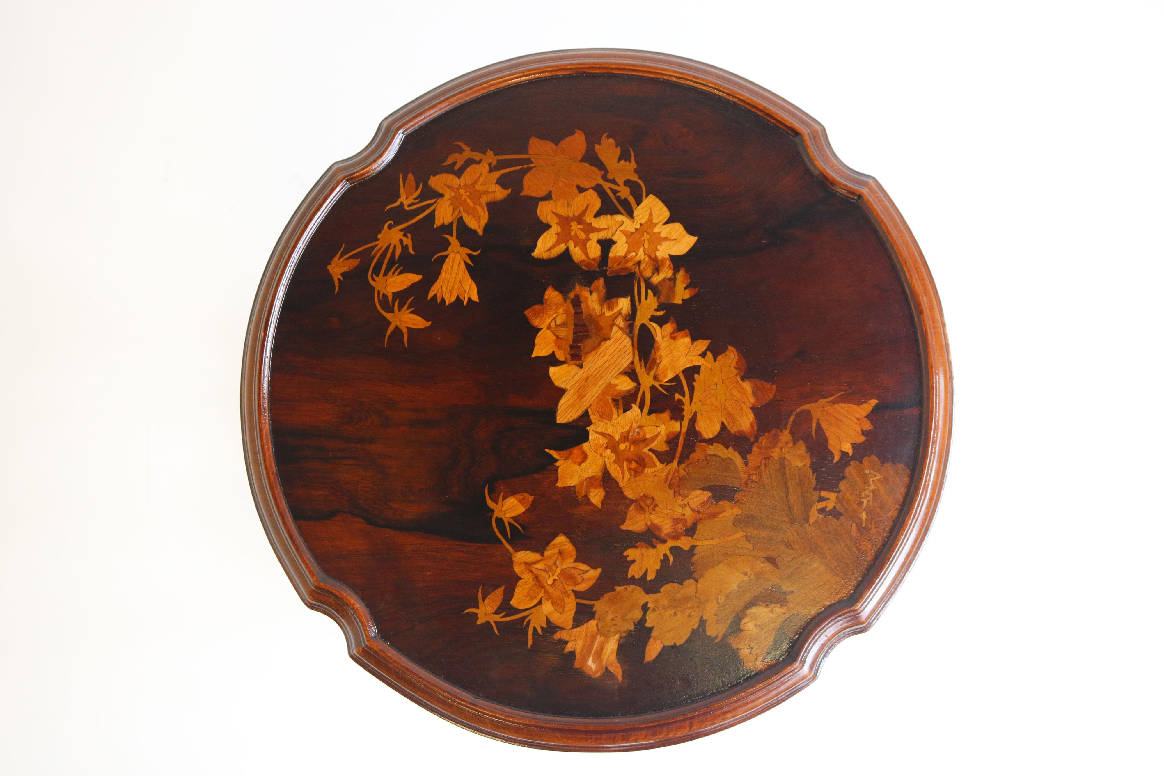 Rare original Emile Galle side table in Art Nouveau design. This beautiful side table was created by Emile Galle in 1900-1910, during the art nouveau period. It features exquisite marquetry woodwork that is inspired by nature. The side table is
