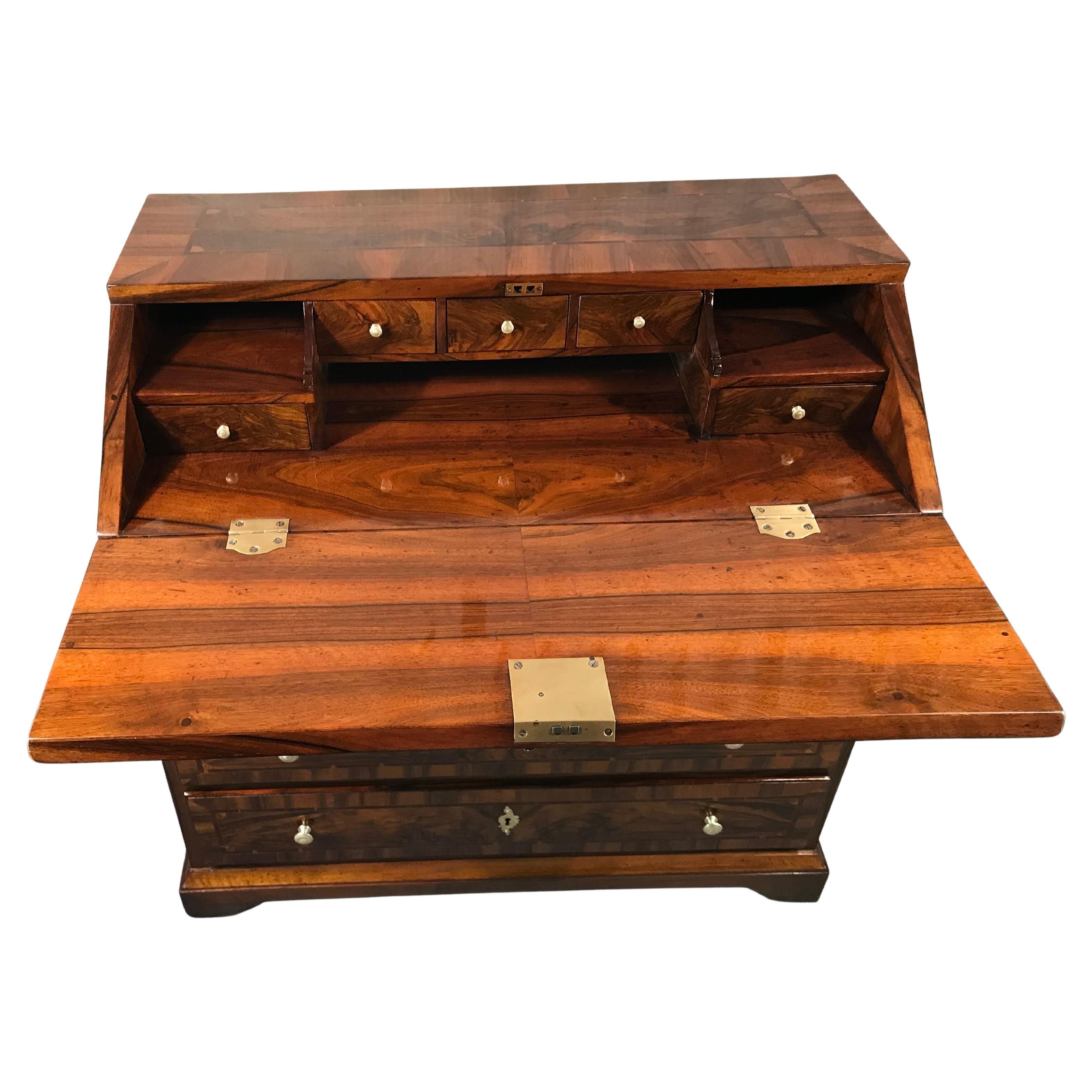 Original Antique Baroque Secretary Desk, Germany, 1750
This exquisite antique Baroque secretary desk from Germany (circa 1750) is a rare find for antique furniture collectors. Featuring a stunning bookmatched walnut veneer, this elegant 18th-century