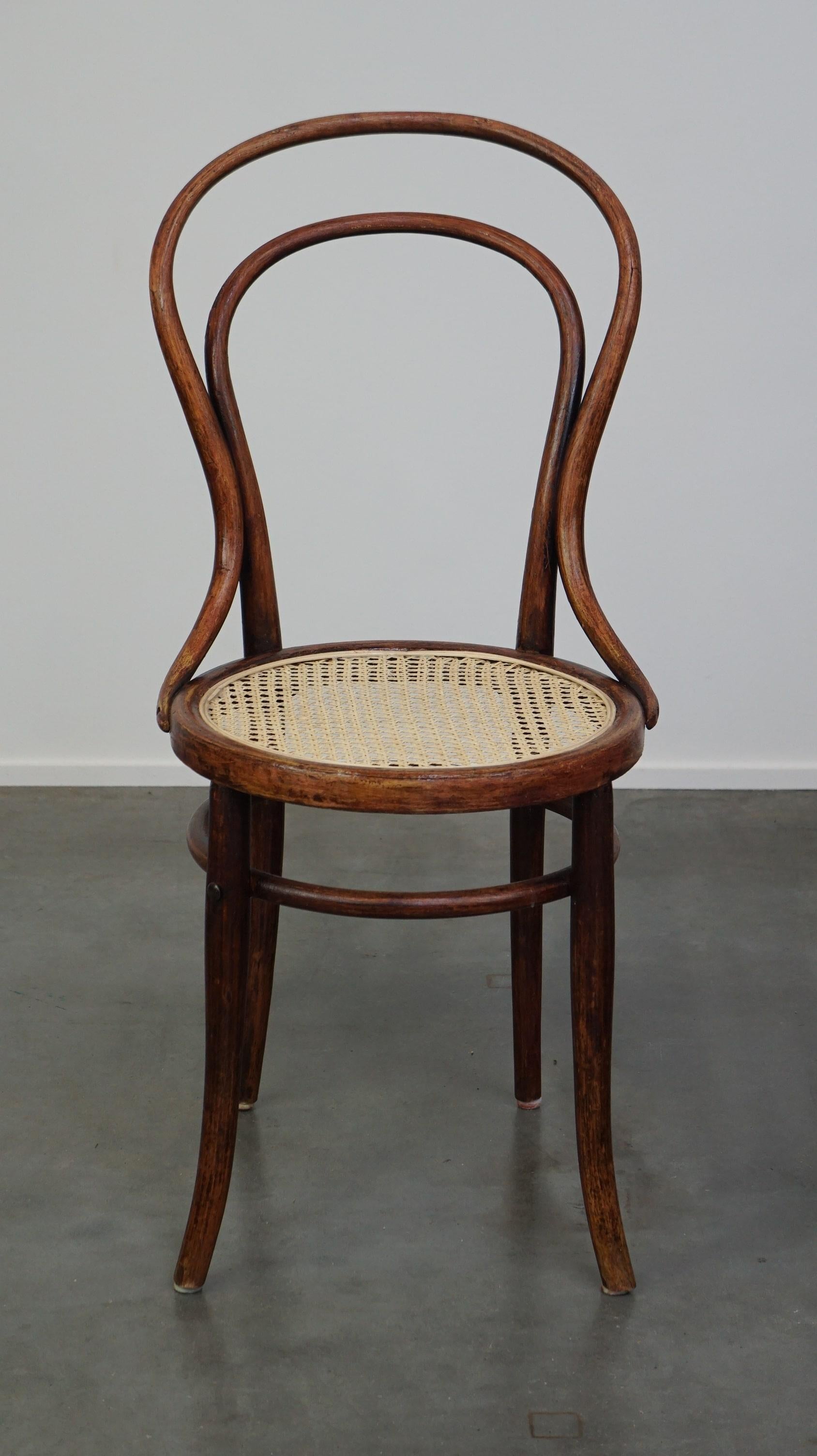 This antique bistro chair, model no. 14, was designed by Thonet and was one of Thonet's most popular chairs alongside chair no. 18. This chair was produced by the Austrian Josef Hoffmann, probably around 1900. This model is still being produced, but