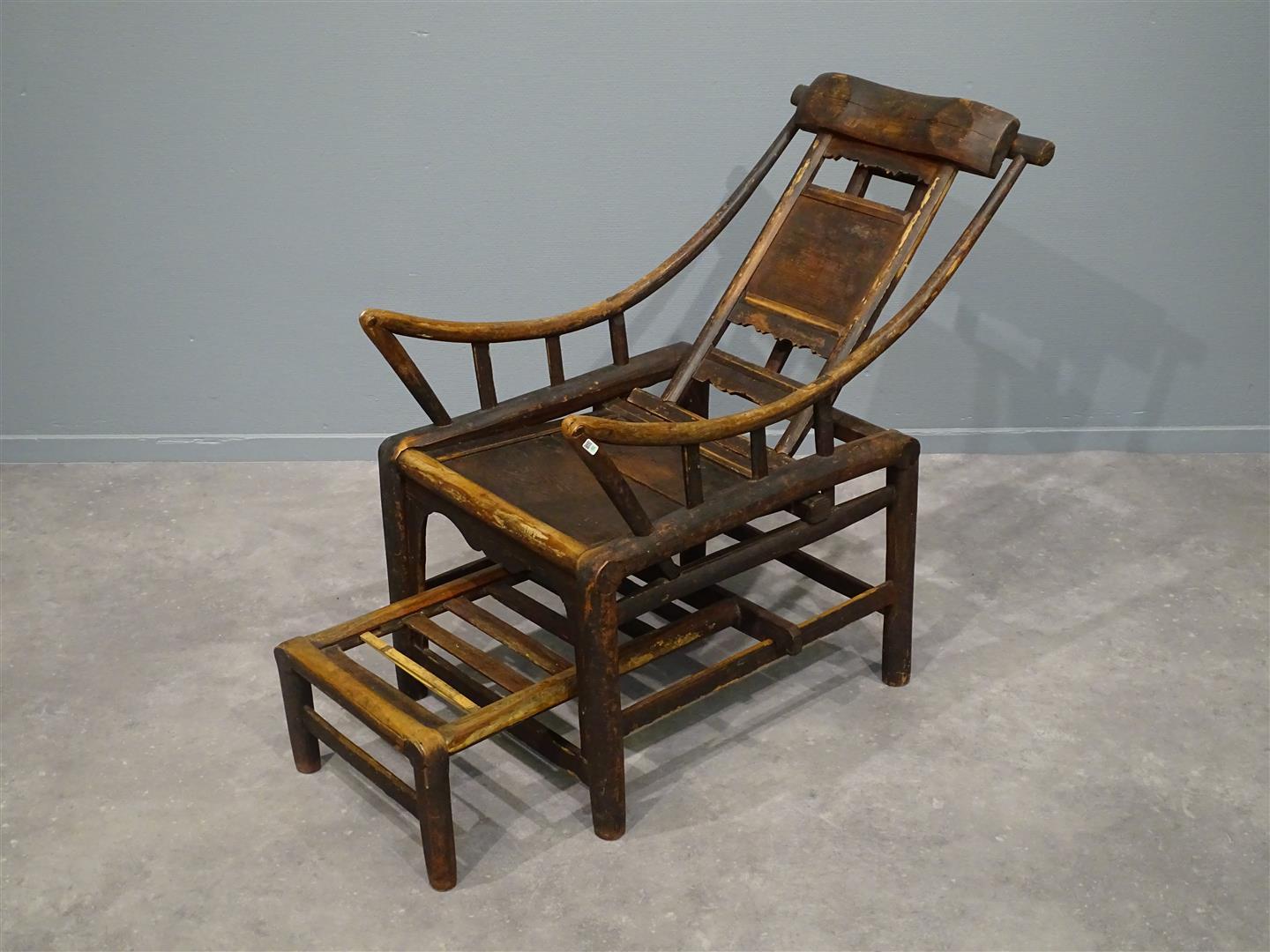 Mid 19th century chinese reclinable lounge chair in softwood. This chair is in a lovely patinated condition. The chair needles to say is reclinable and adjustable to ones liking. The width shown is with the footrest under the chair.