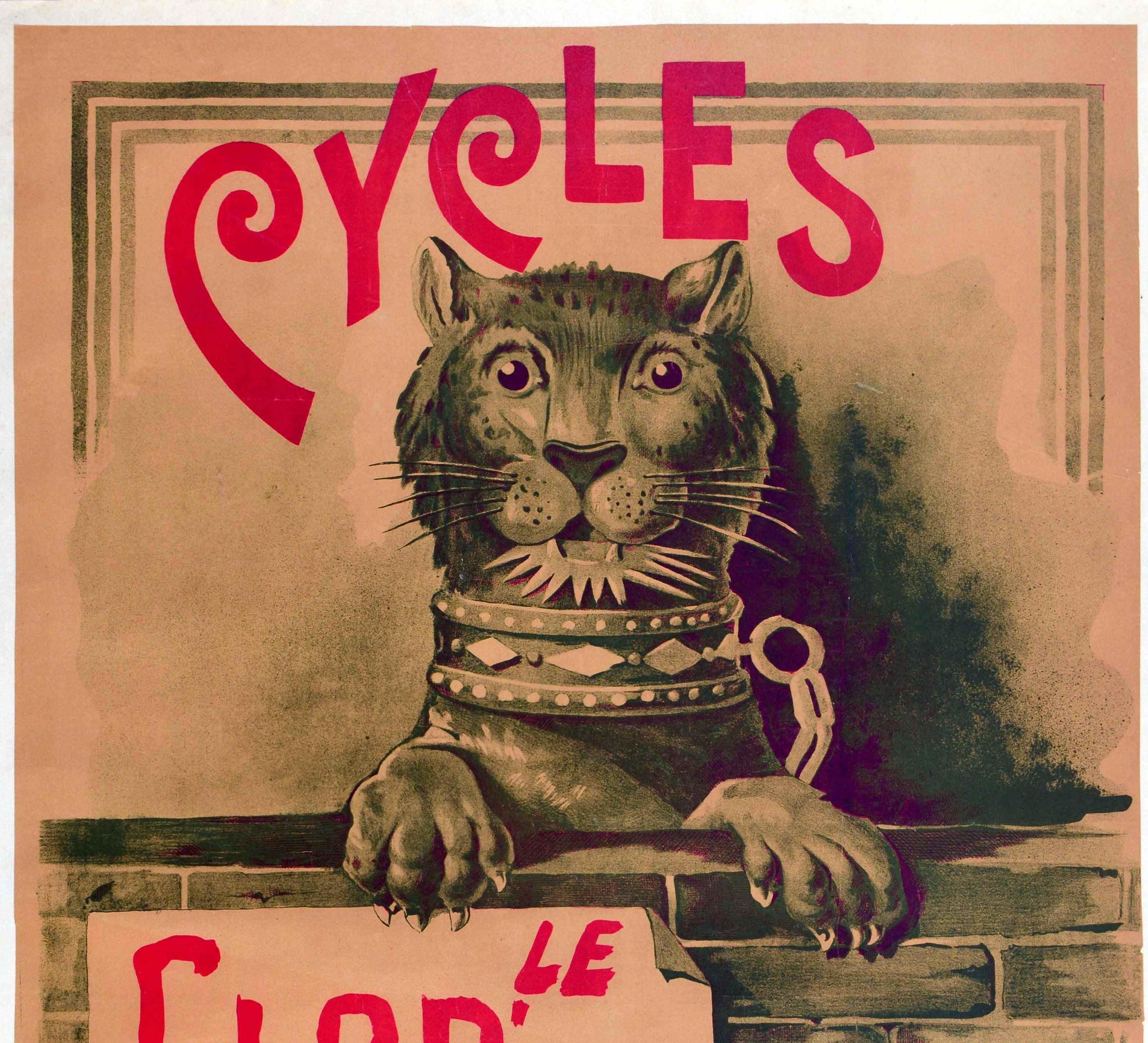 Original antique bicycle advertising poster for Le Glob' Trotter Cycles Paris featuring great artwork of a lioness looking out to the viewer, her paws clawing on the top of a brick wall with a sign for The Globe Trotter pasted on it, and the bold